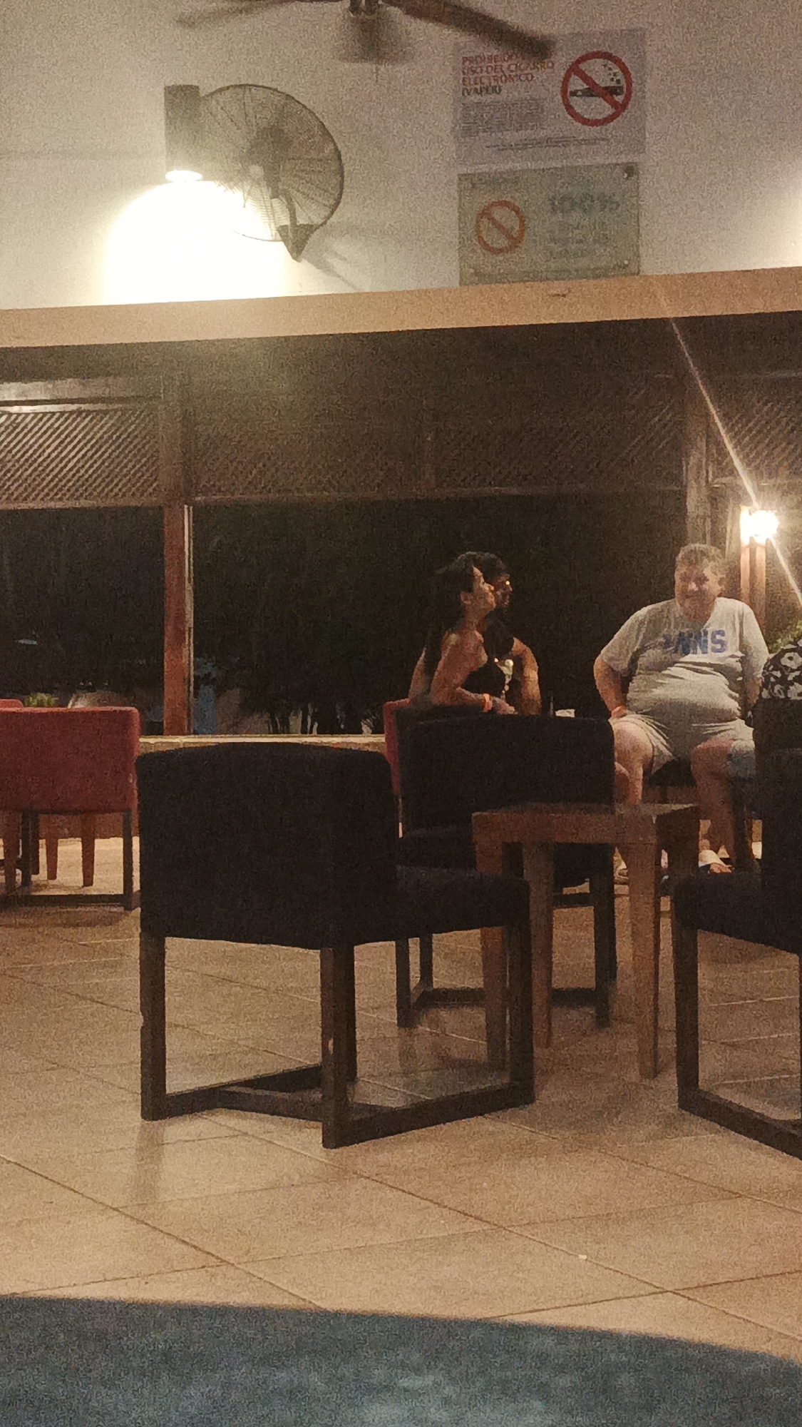 Late-night social gathering captured at Playa El Agua venue