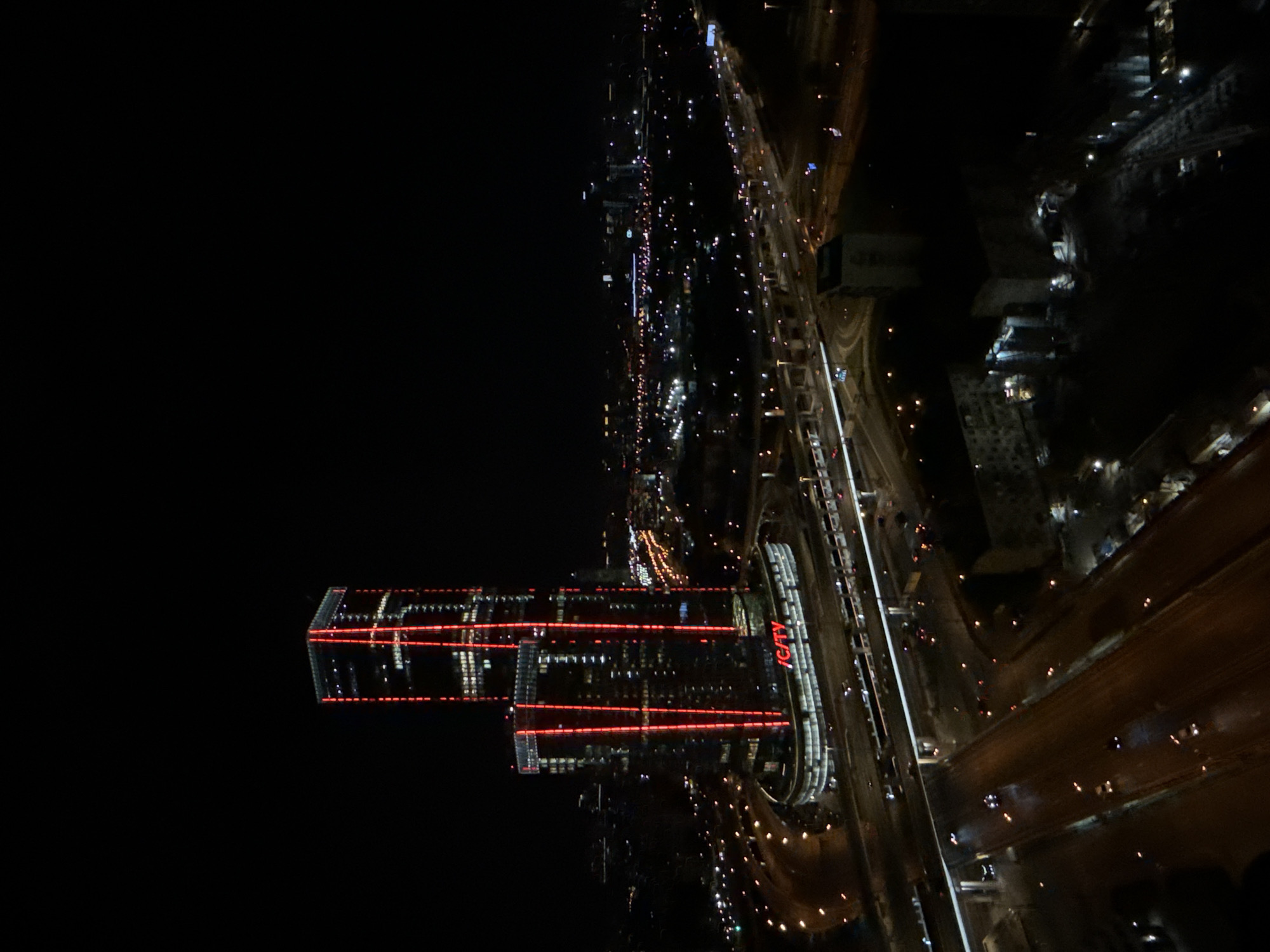 Nighttime aerial view captures illuminated skyscrapers in Khimki, Russia