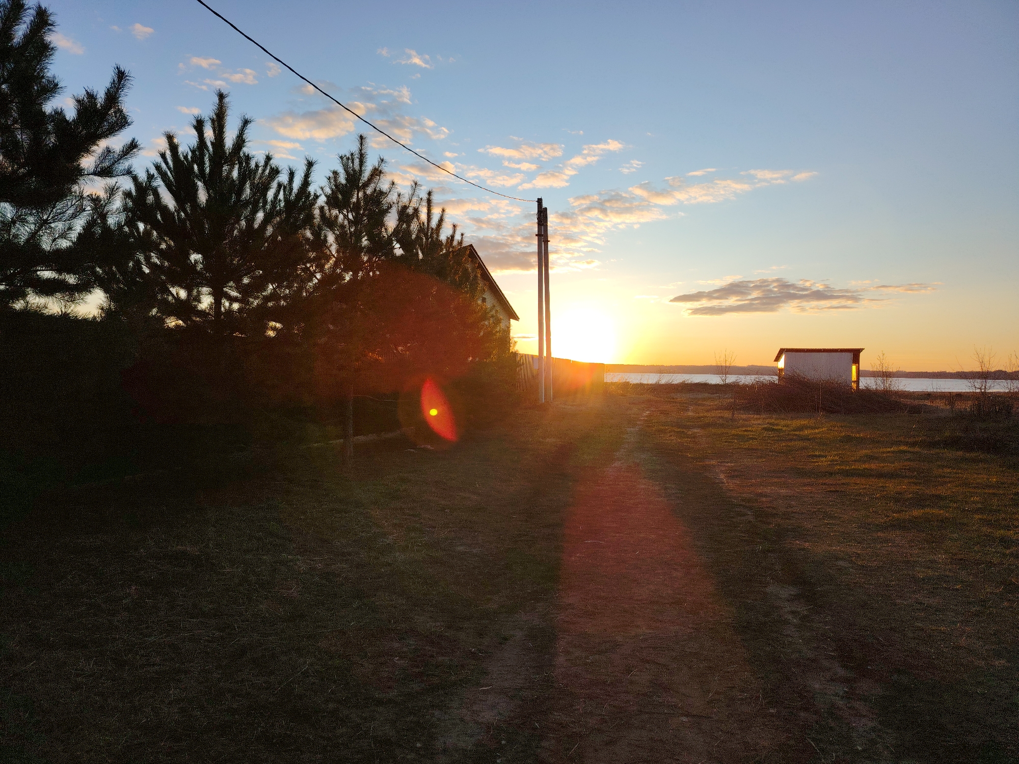 Sunset scenes captured in Elovo, Russia including beach activity