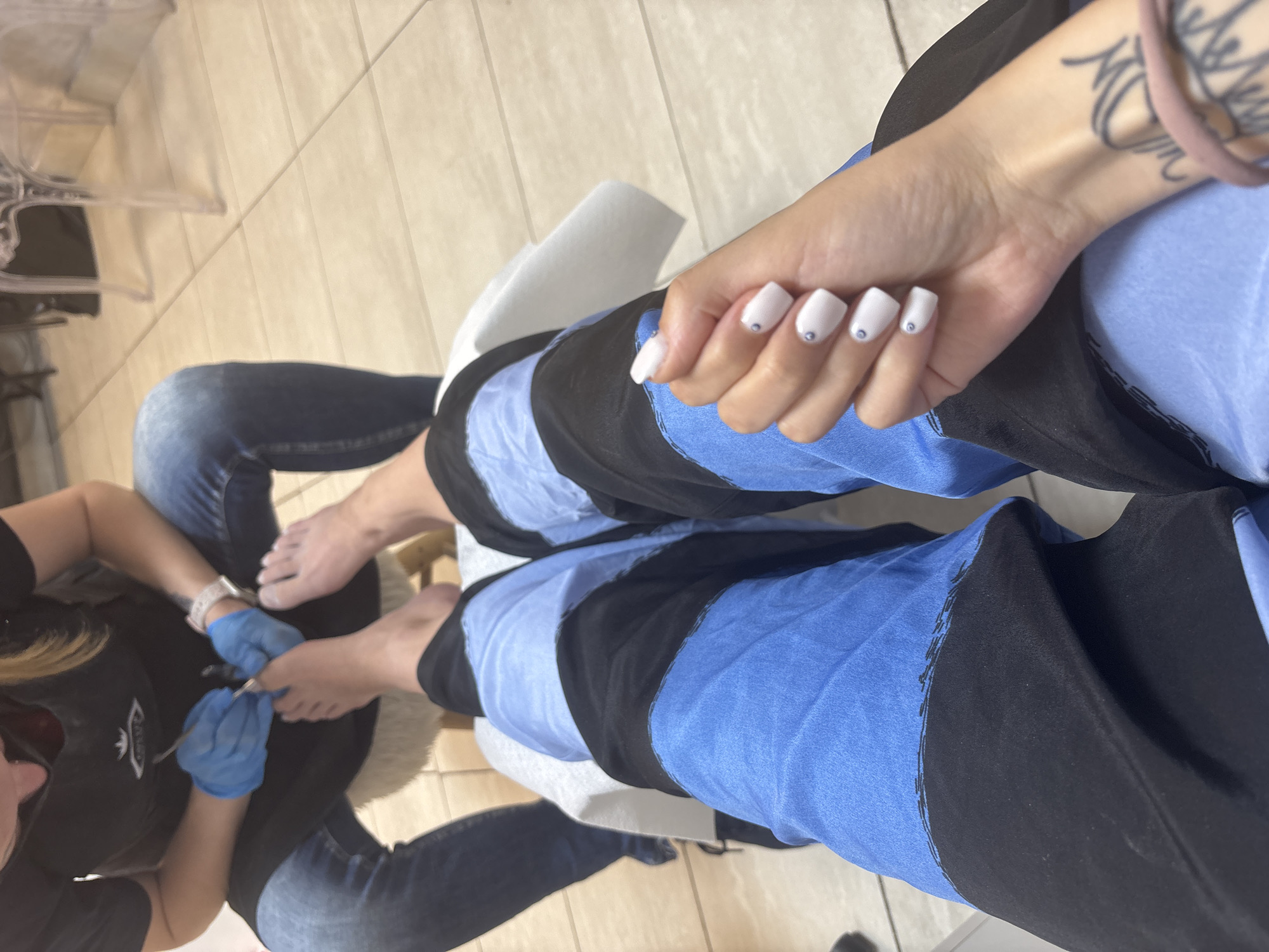Person gets decorated manicure and pedicure at Sofia nail salon