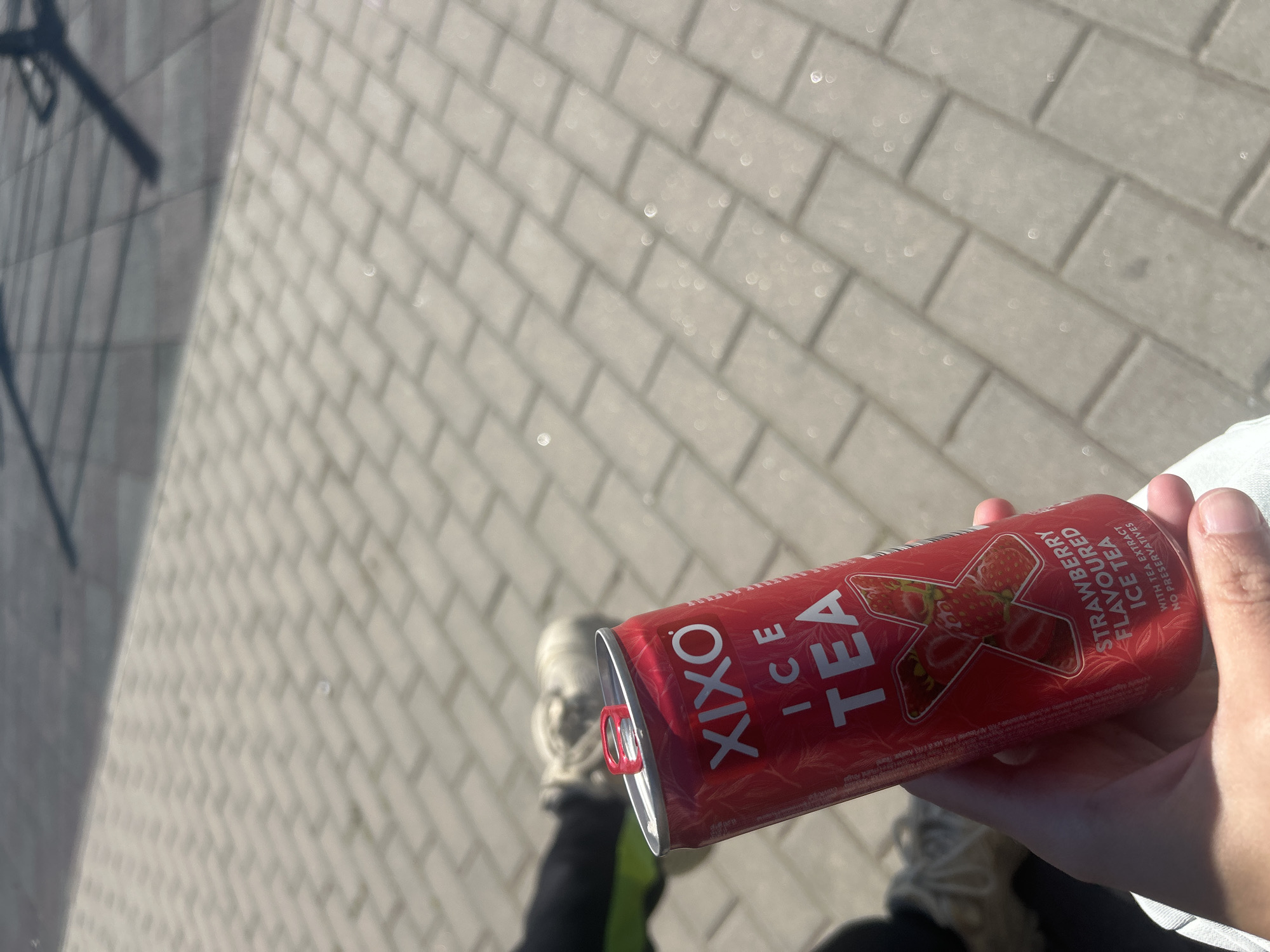 Person enjoys strawberry ice tea on Burgas walkway