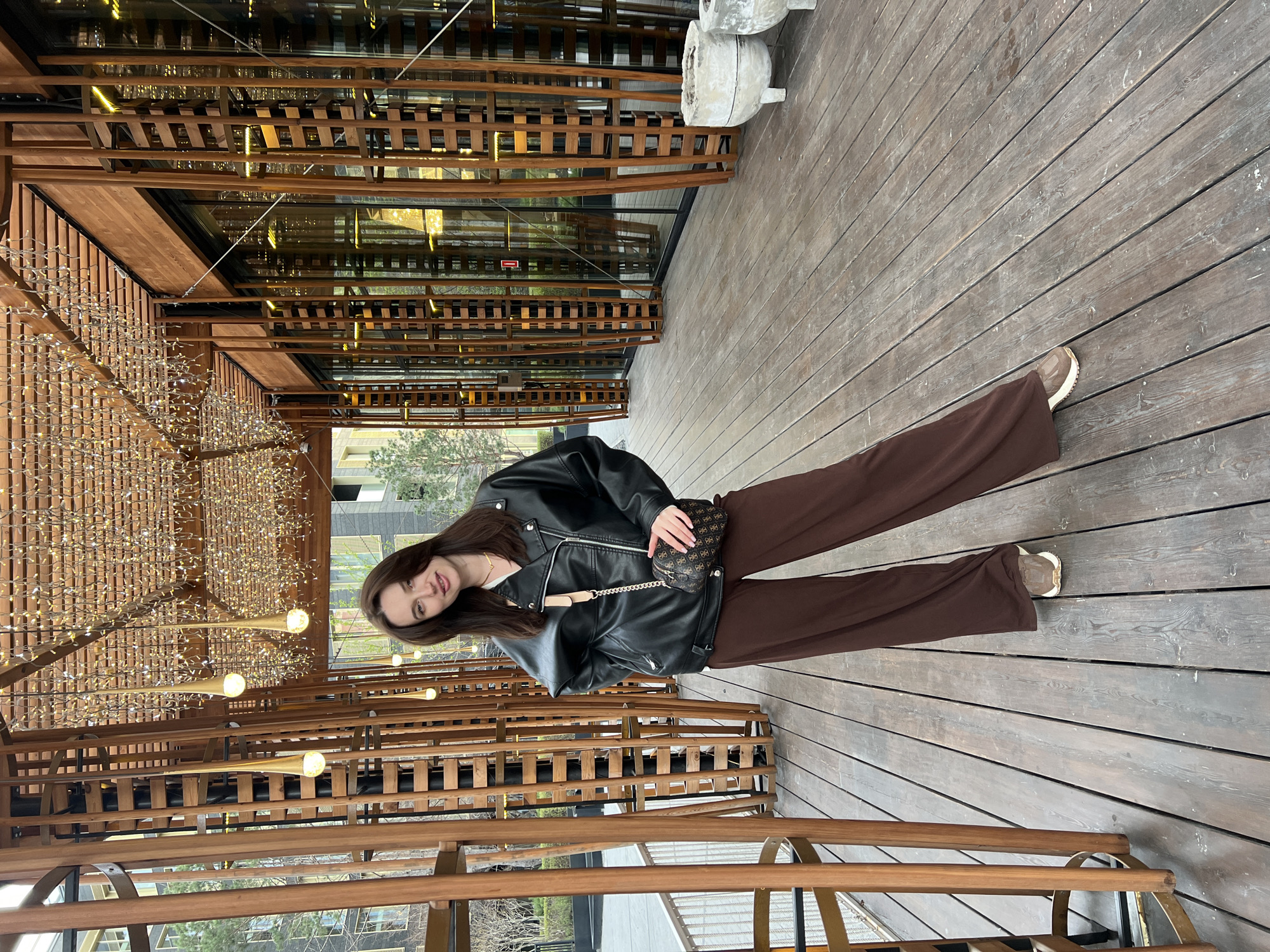 Woman photographed at multiple Tyumen landmarks during afternoon outing