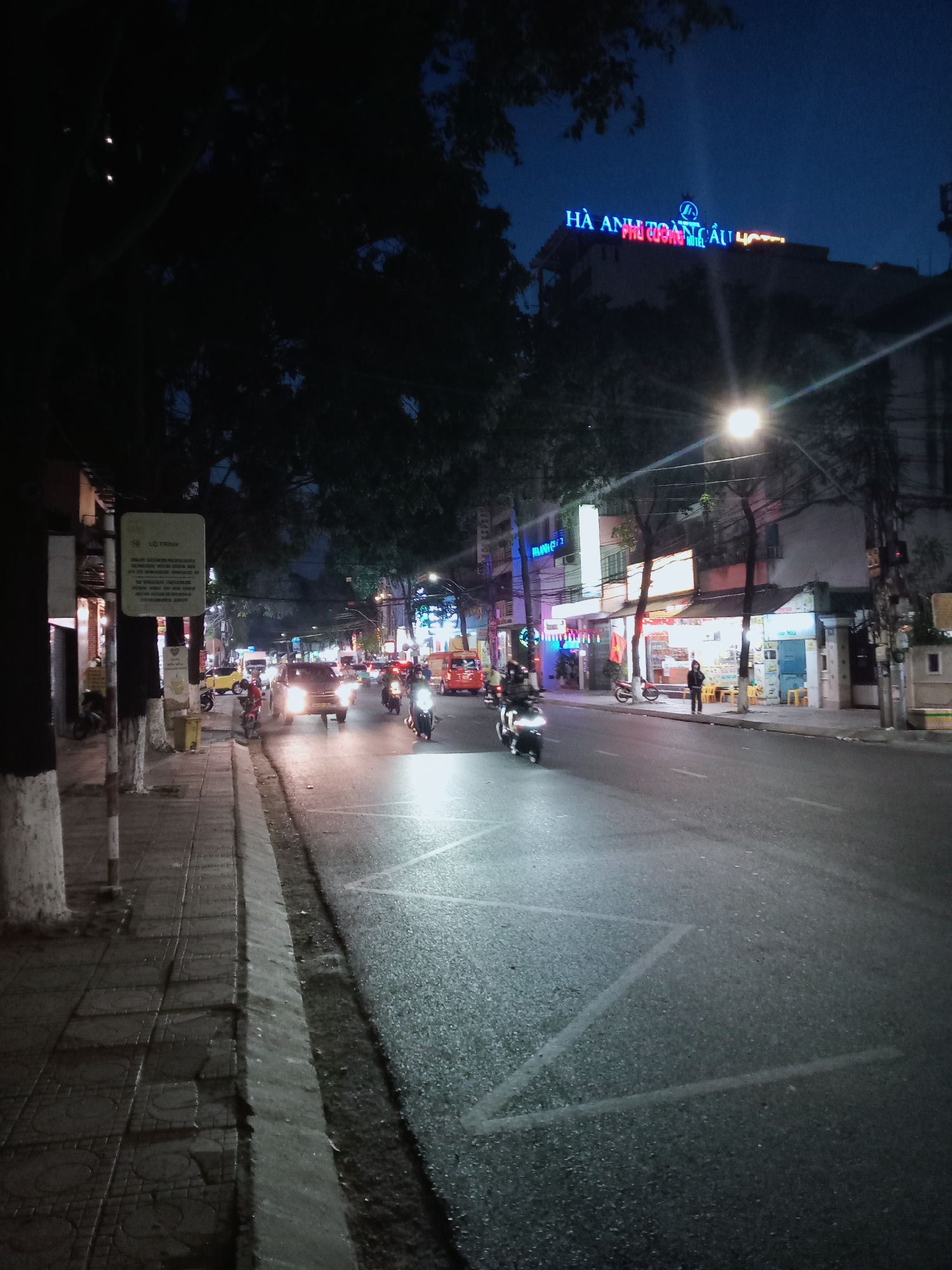 Evening street activity documented in Nha Trang, Vietnam