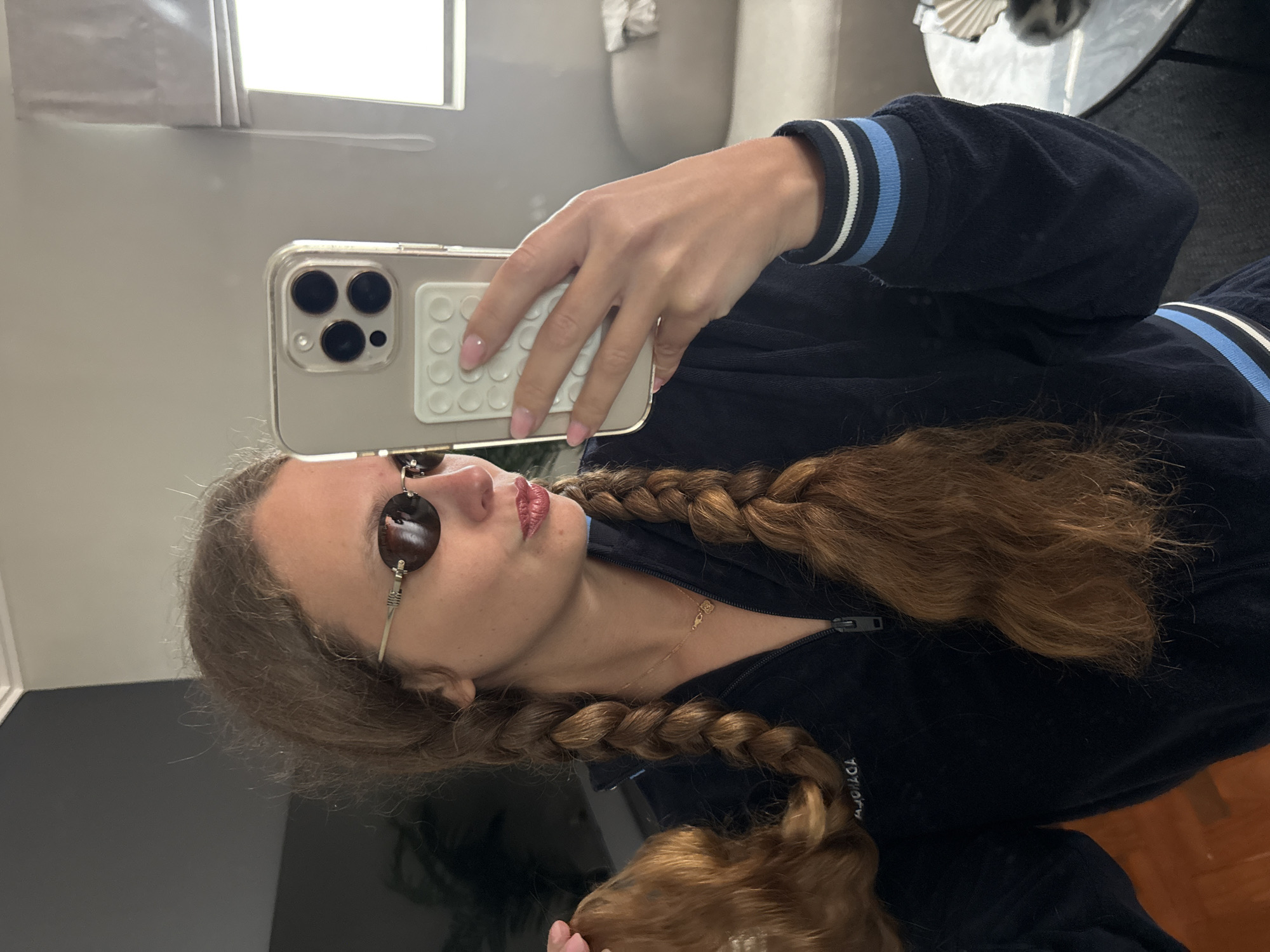 Woman takes bathroom selfies in Cape Town tracksuit