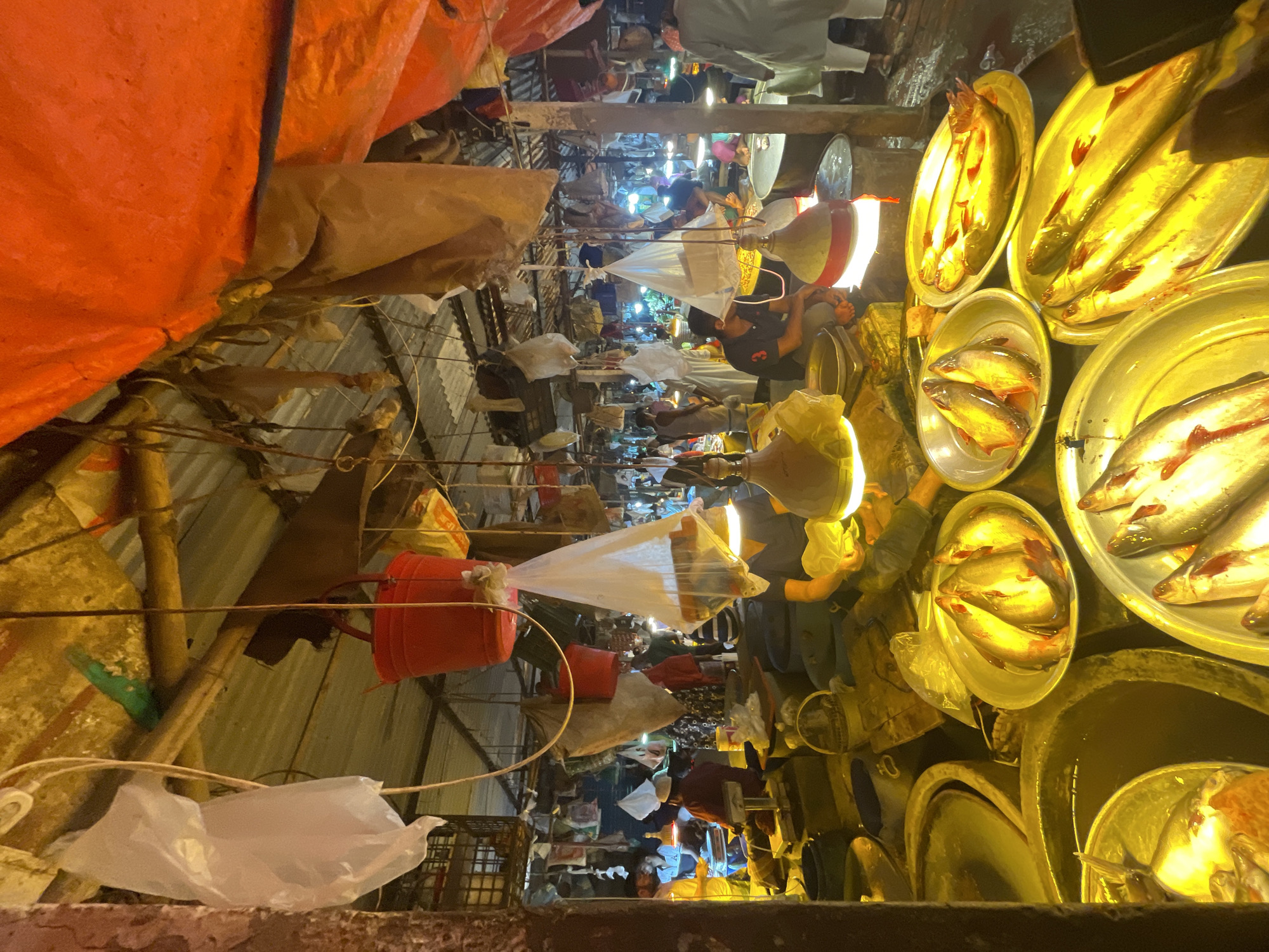 Night market bustles with vendors in Dhaka, Bangladesh