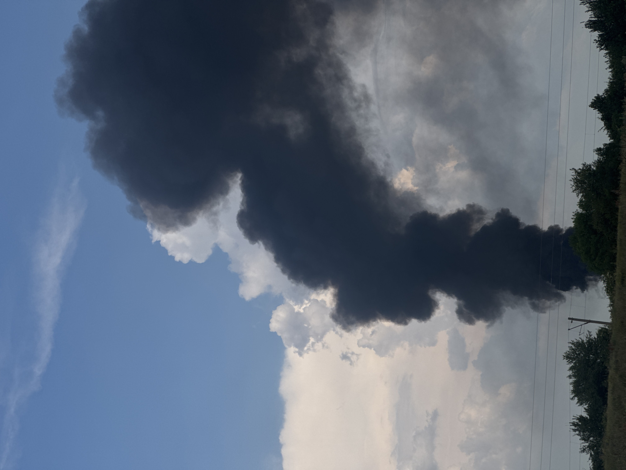 Heavy black smoke billows into clear sky over Bozhurishte