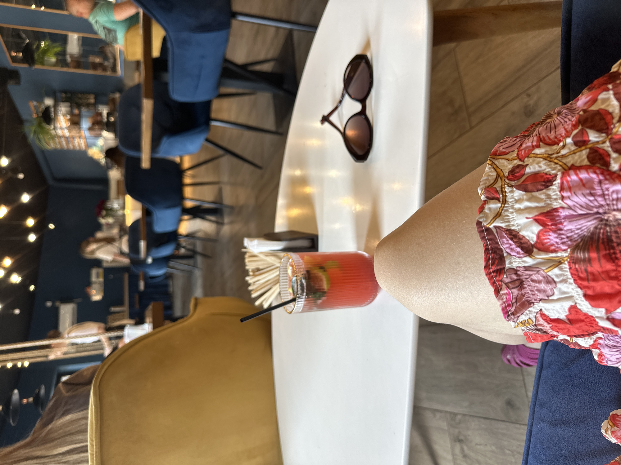 Woman enjoys red drink at Kryvyi Rih cafe