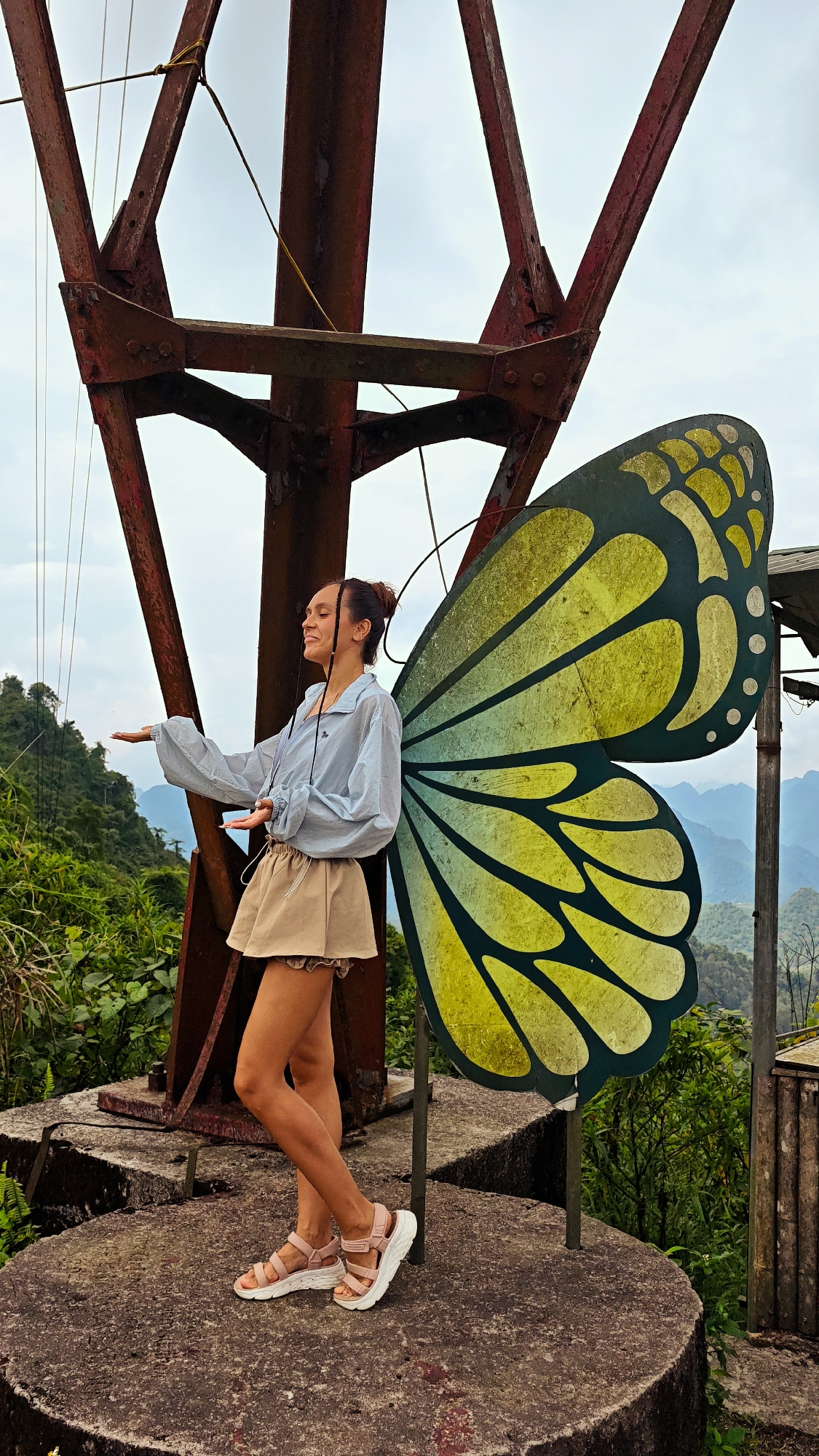 Tourists pose at butterfly displays in northern Vietnam mountains