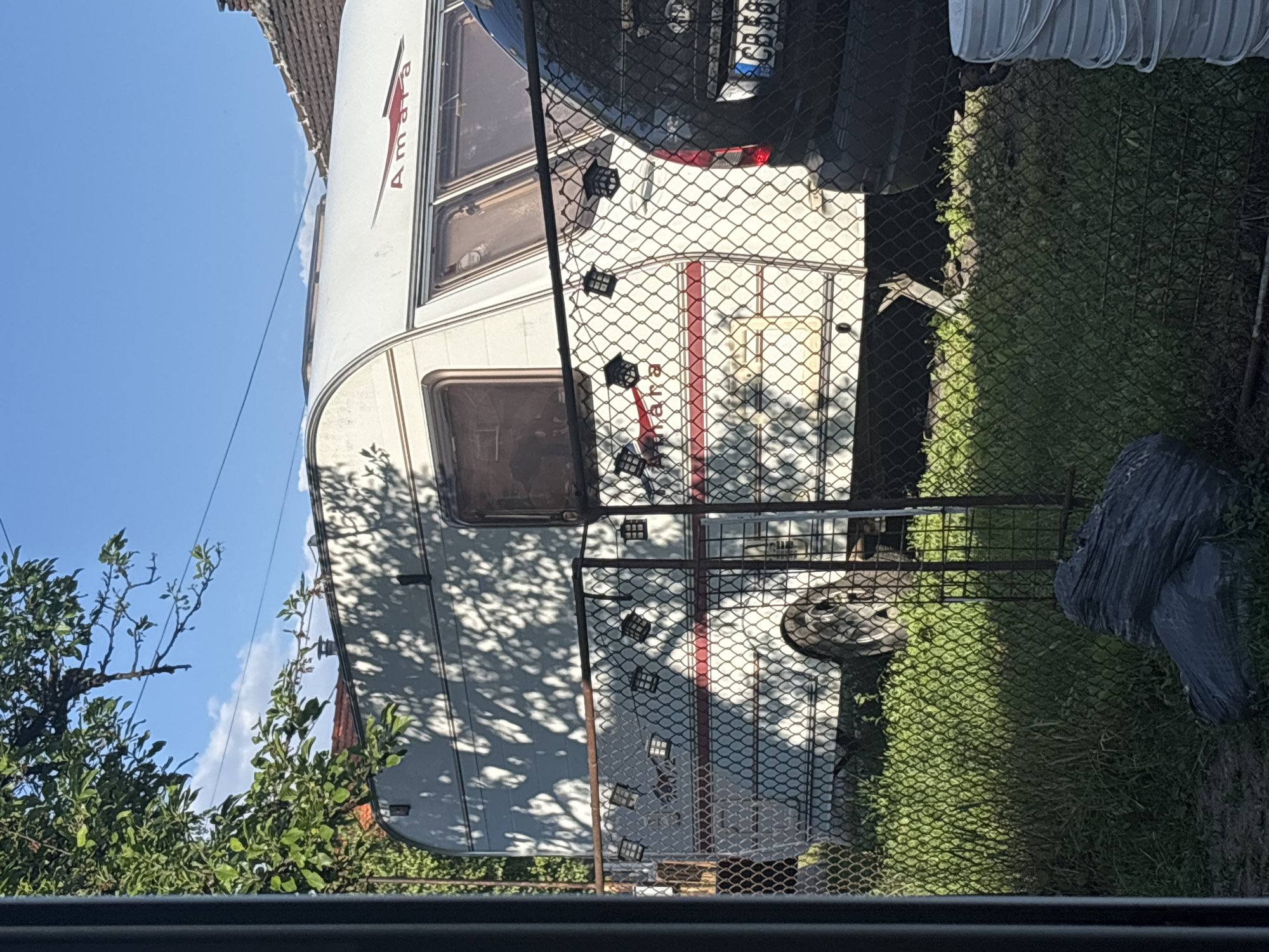 Girl with purple object, caravan spotted in Pernik