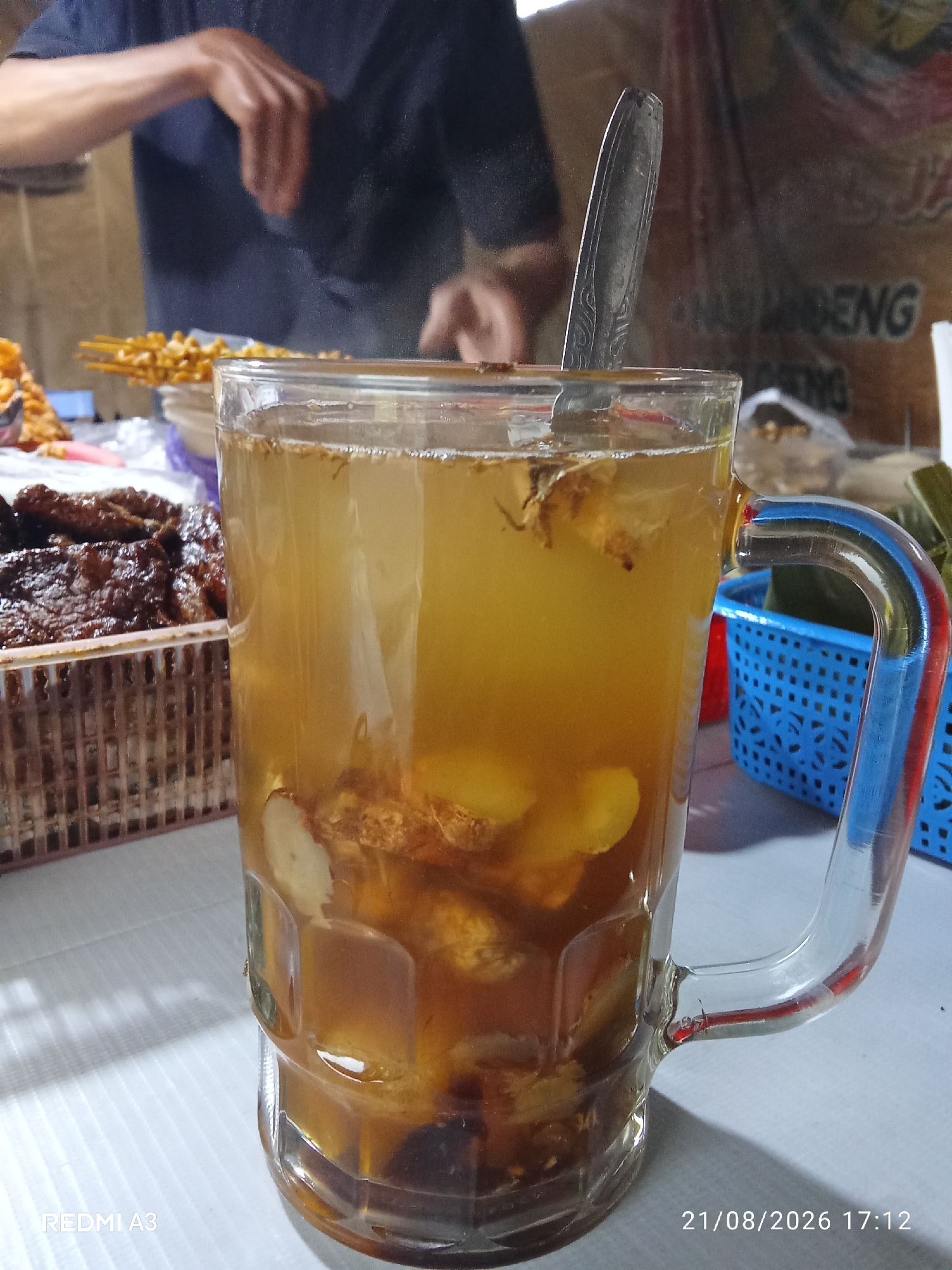 Morning gathering at a Central Java mosque with herbal tea