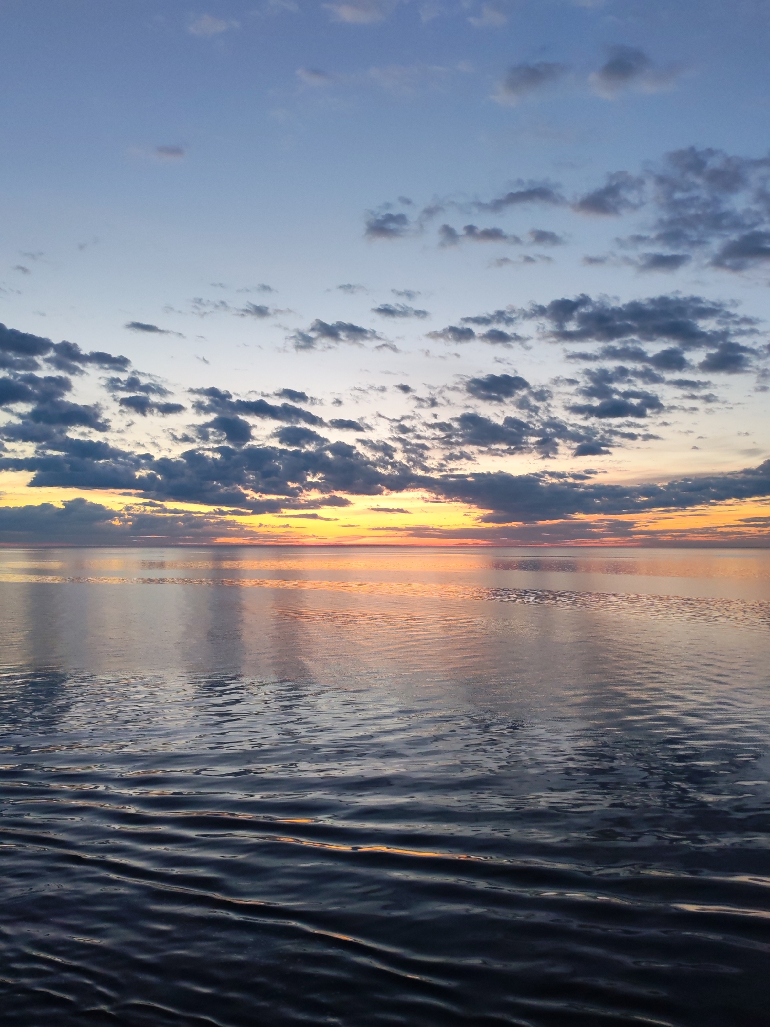 Ship passengers document dawn transition over Russian waters
