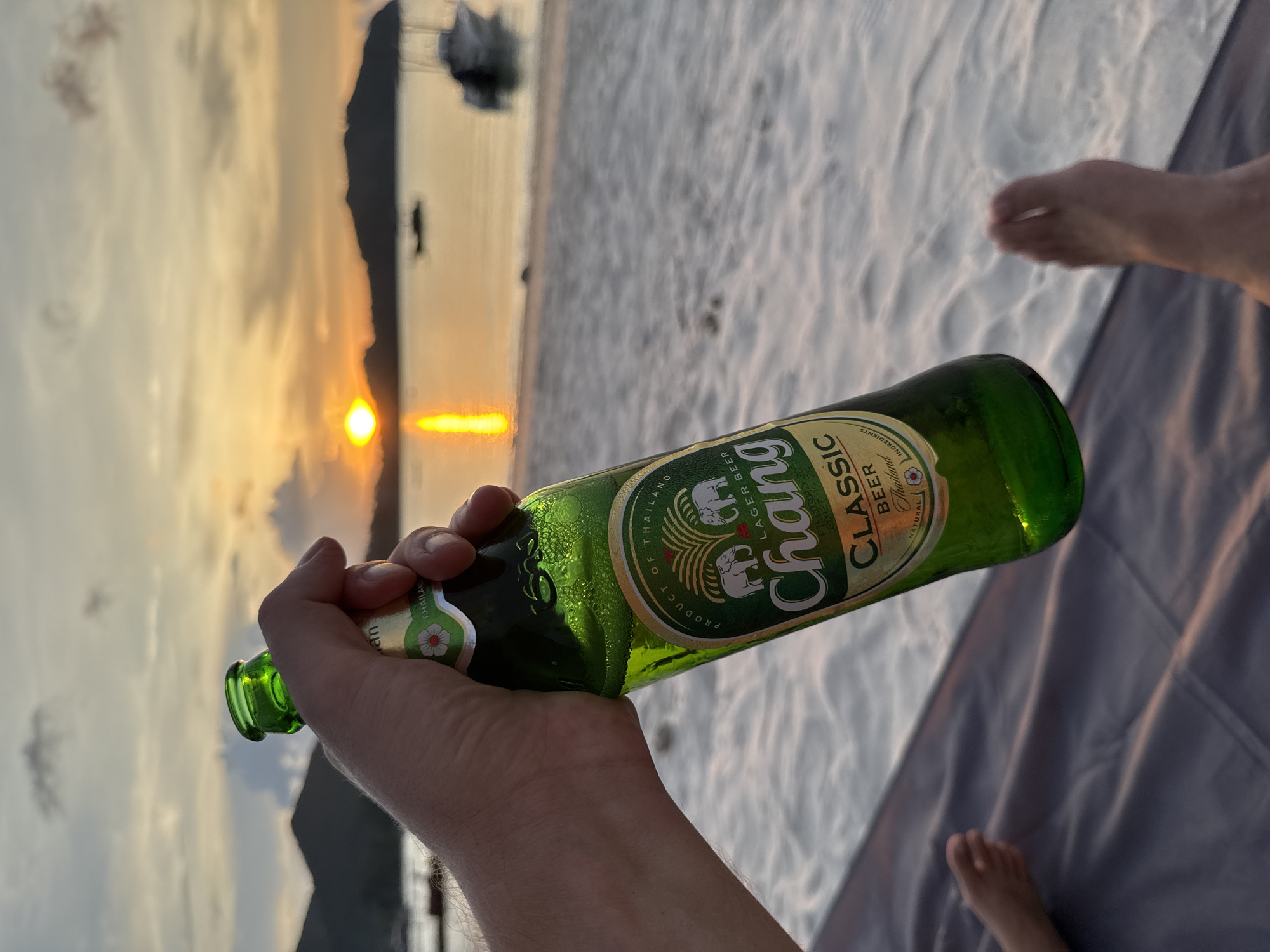 Beach sunset moment captured with Chang beer in Thailand