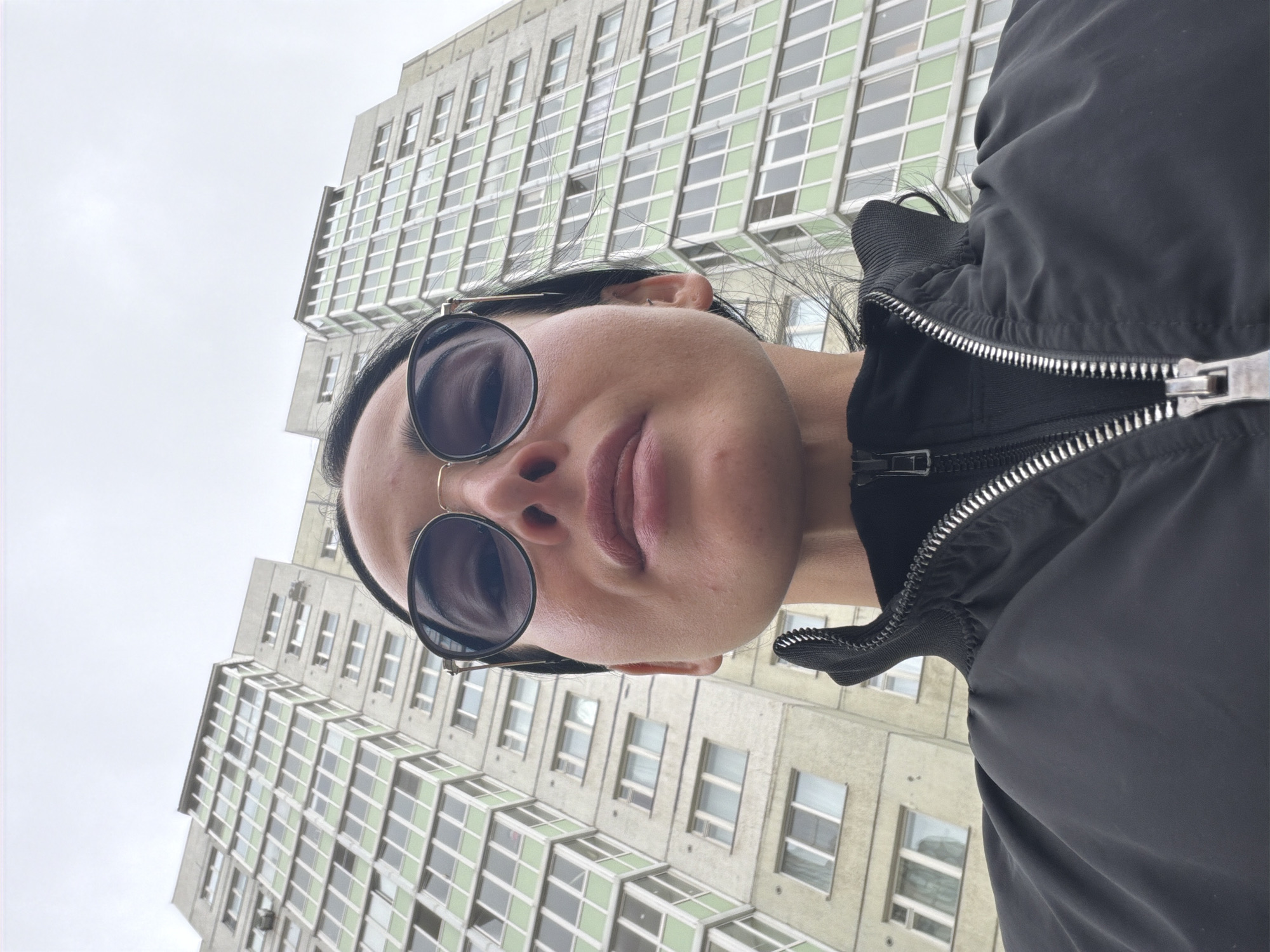 Morning selfie taken outside tall building in Saint Petersburg