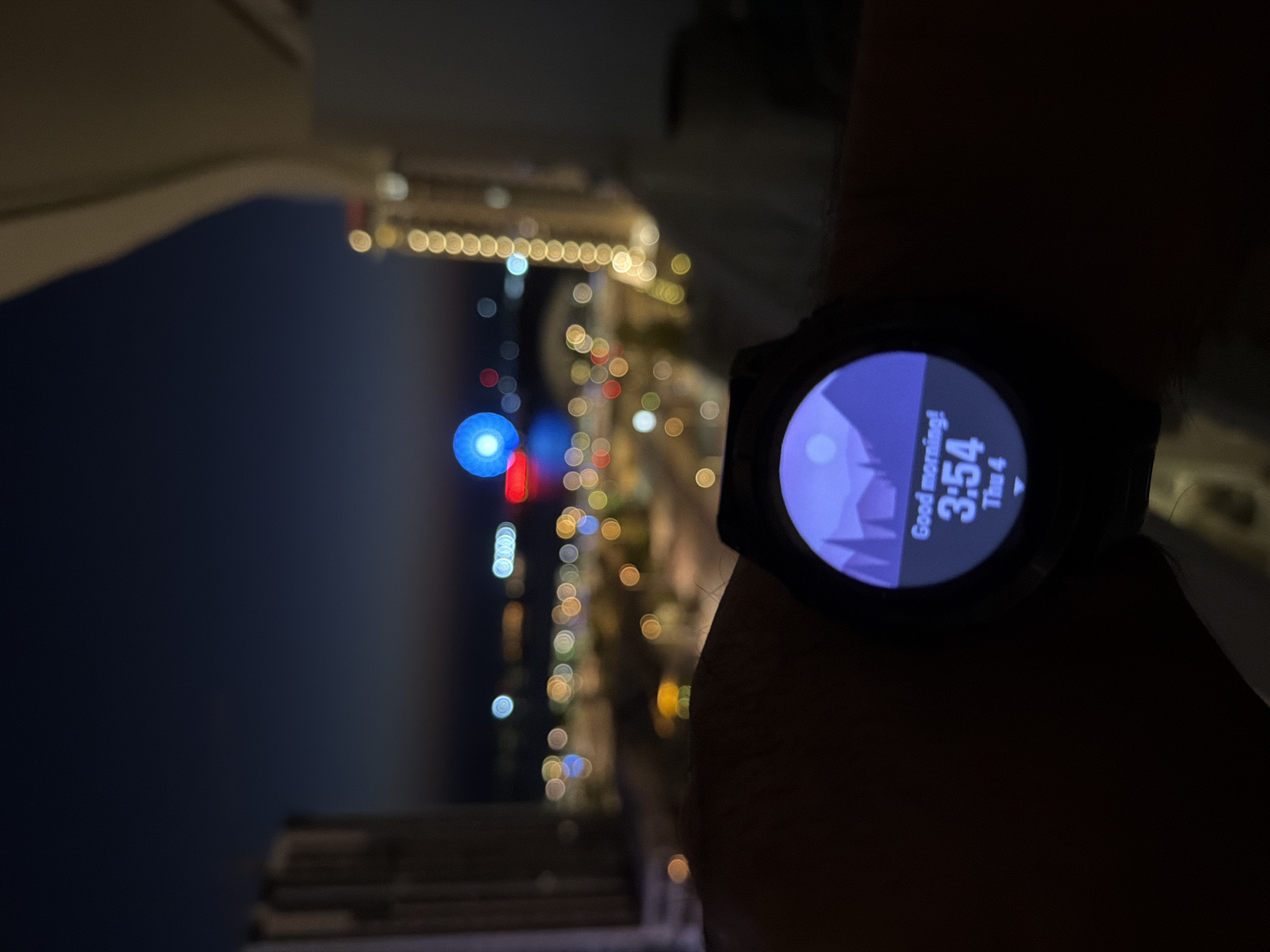 Night observer documents Lusail's illuminated waterfront and Ferris wheel