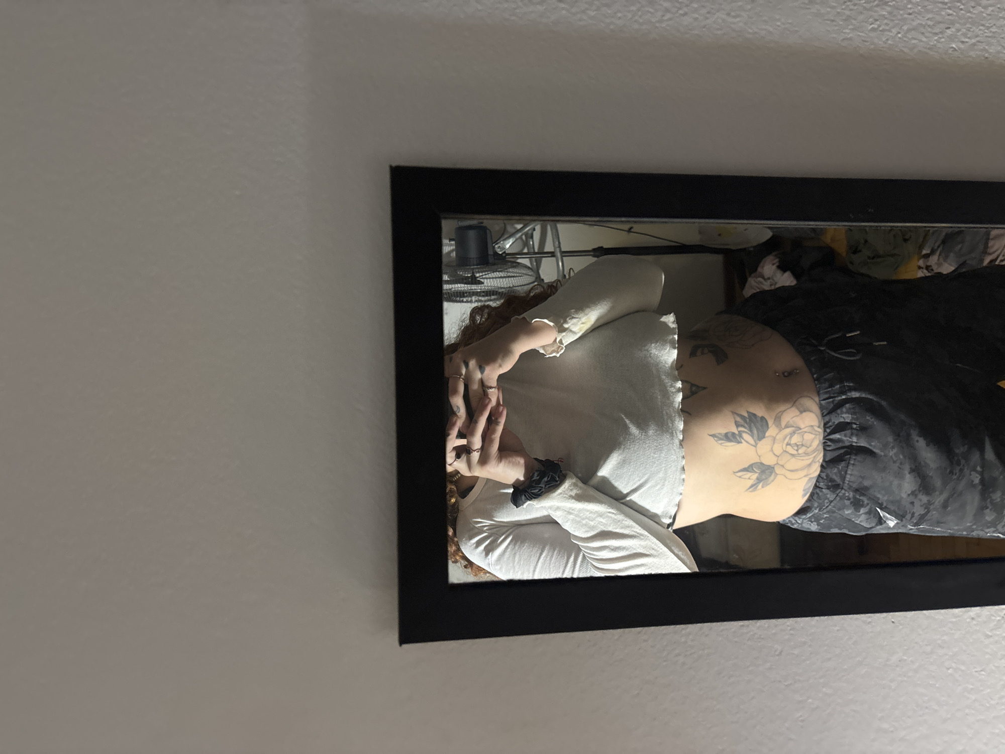 Person takes mirror selfie in Buenos Aires apartment
