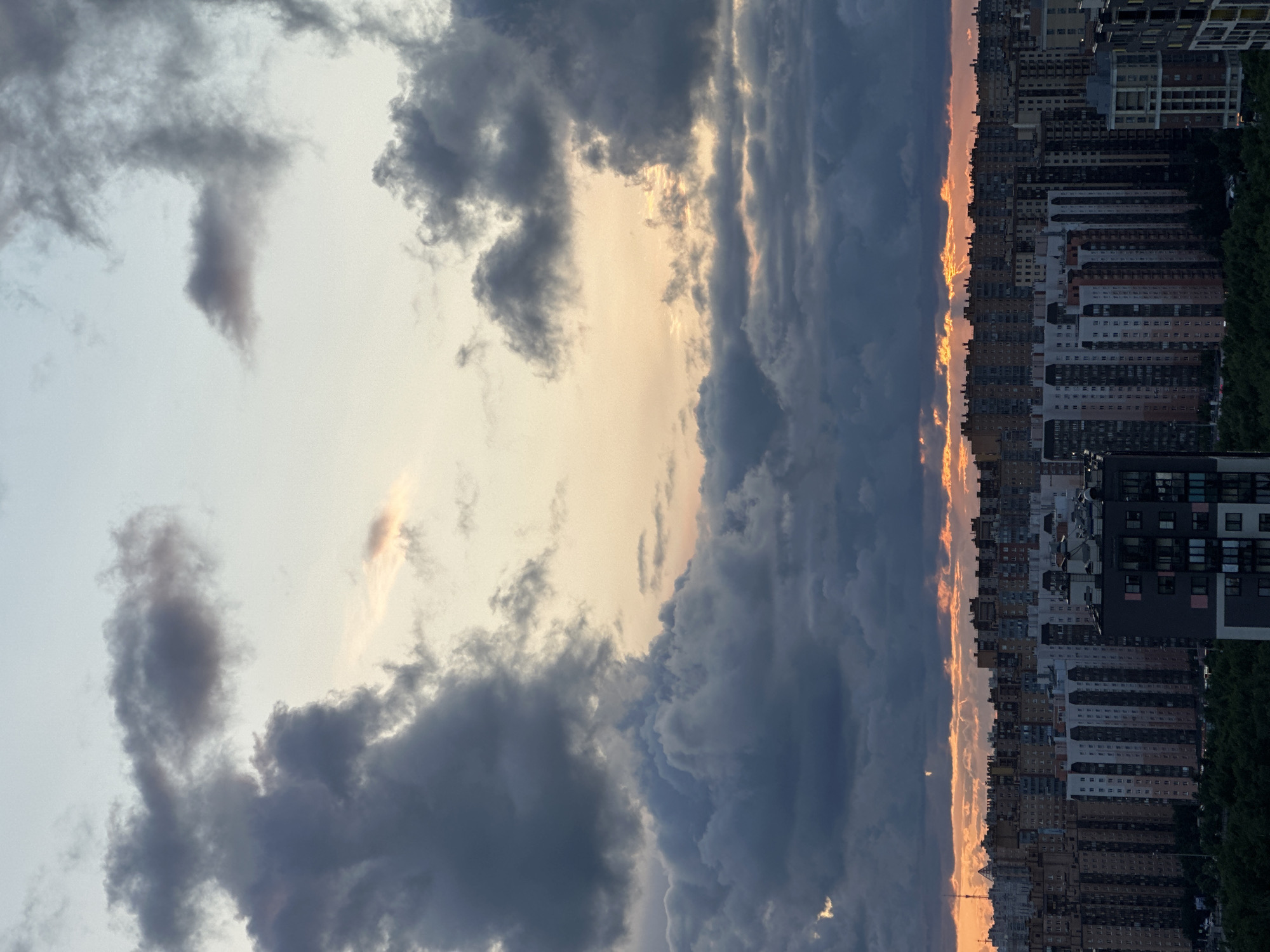 City skyline meets dramatic dusk cloud cover