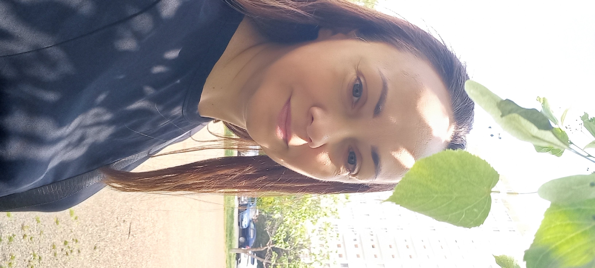 Woman photographed outdoors in sunlight near tree in Krasnodar