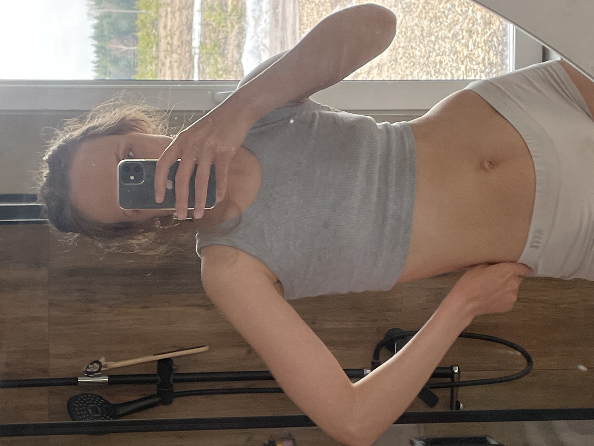 Woman takes bathroom selfies in Podshivalovo, Russia morning