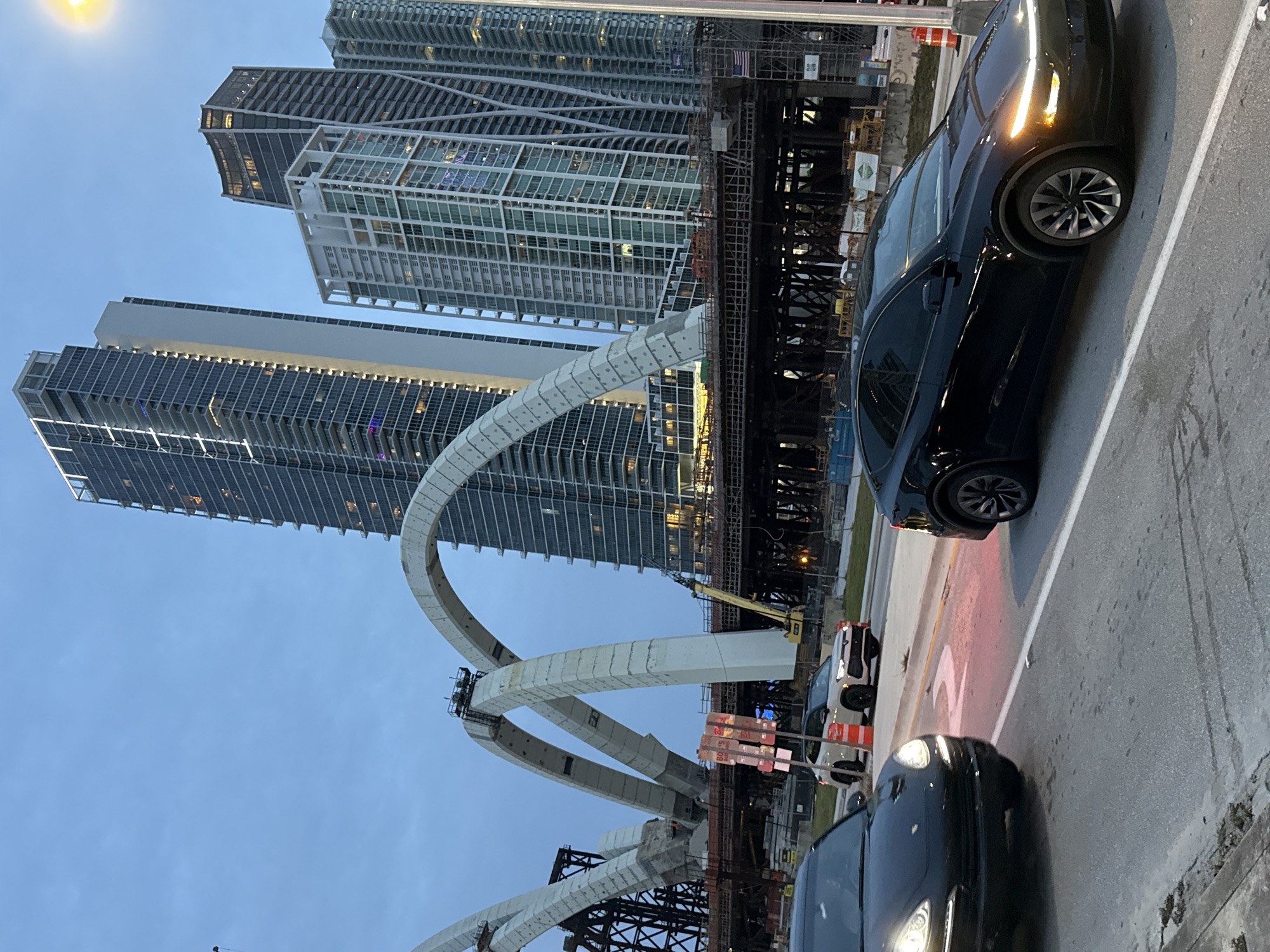 Miami bridge construction underway, arched concrete supports rising