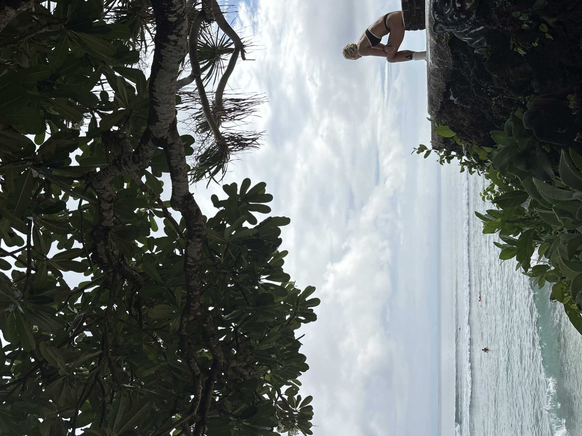 Person enjoys quiet coastal moment in Kuta Selatan