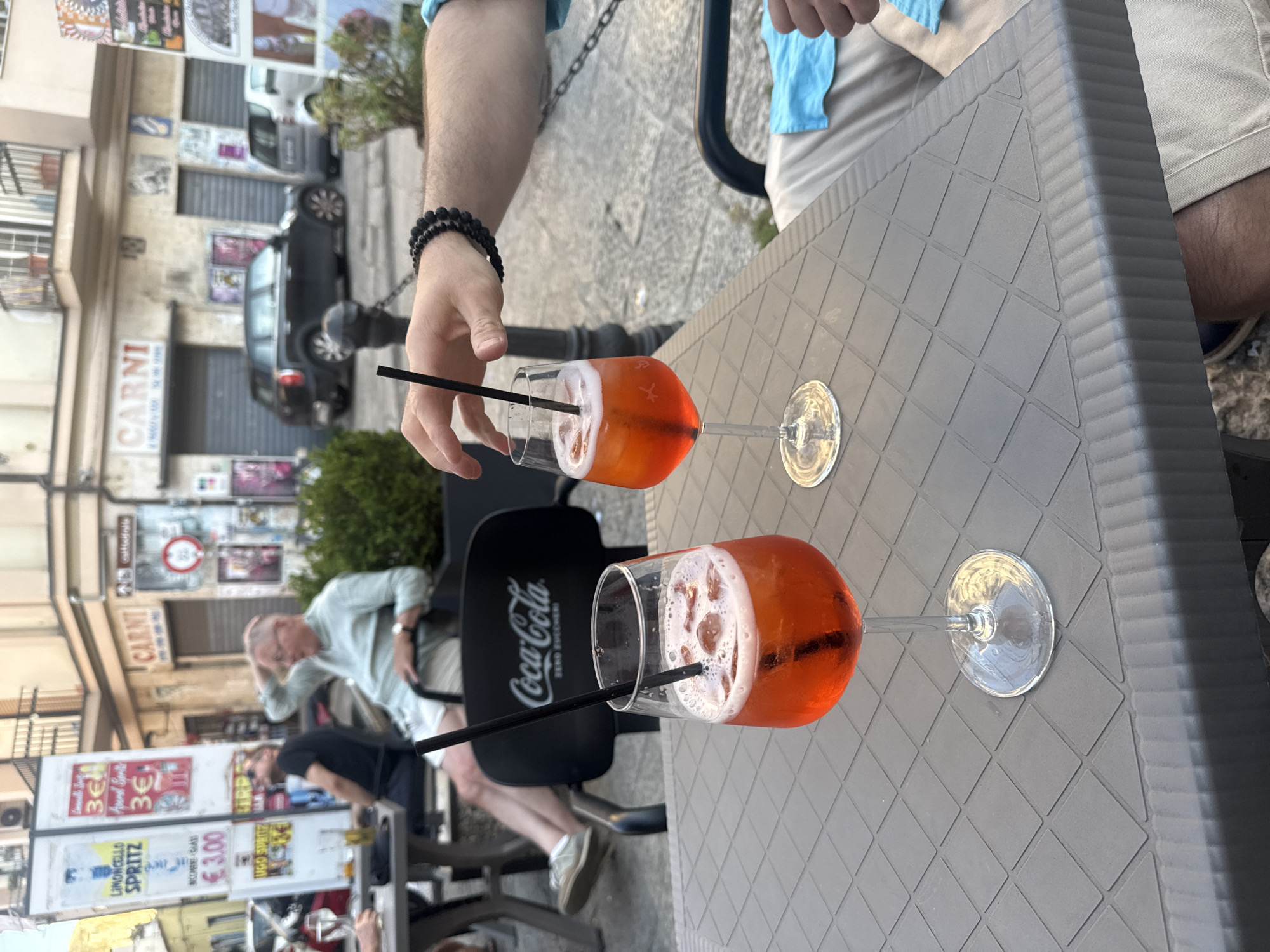 Couple enjoys Aperol Spritz at outdoor café in Palermo