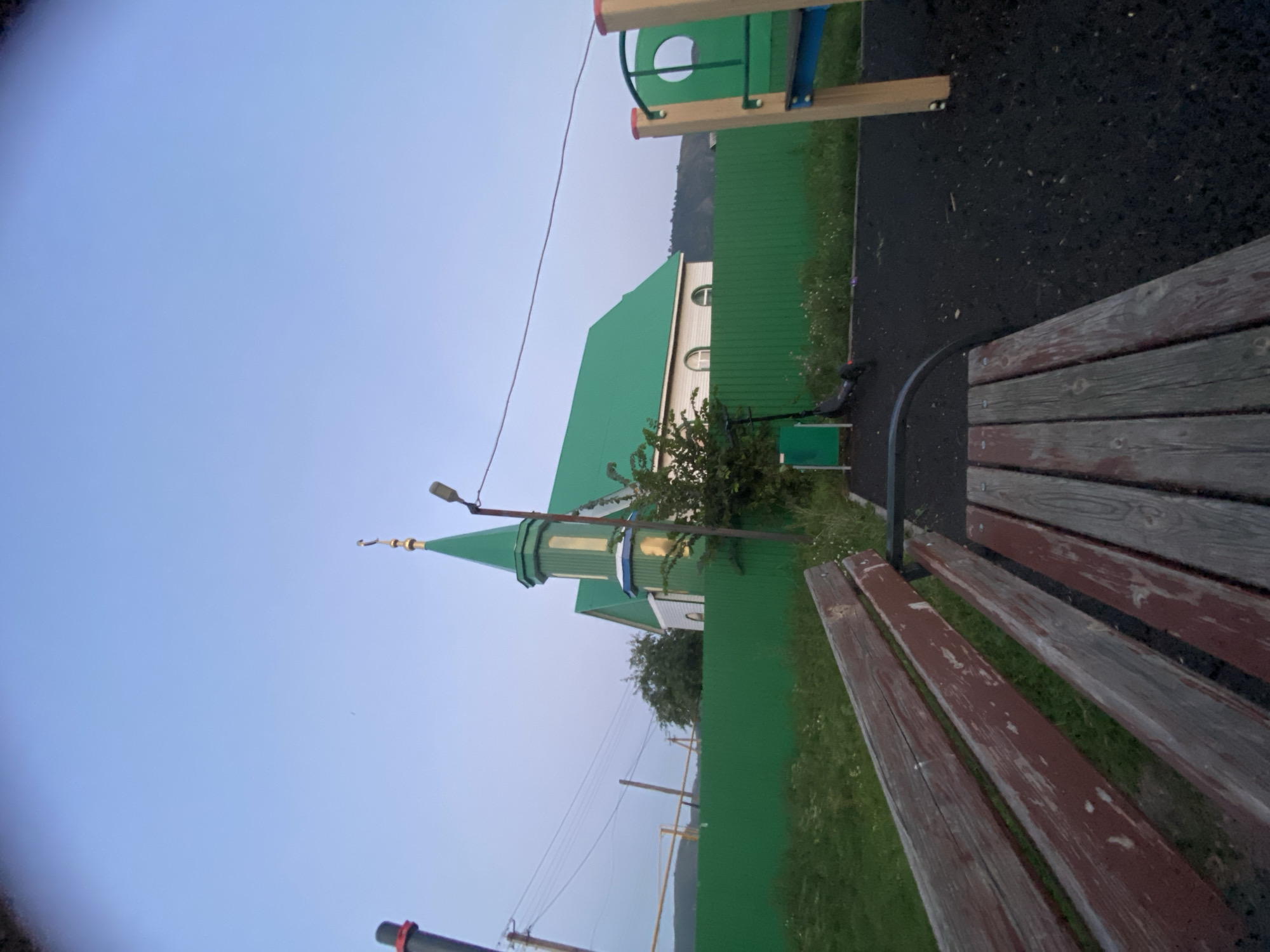 Dusk outing in a small Russian village, mosque and playground in view