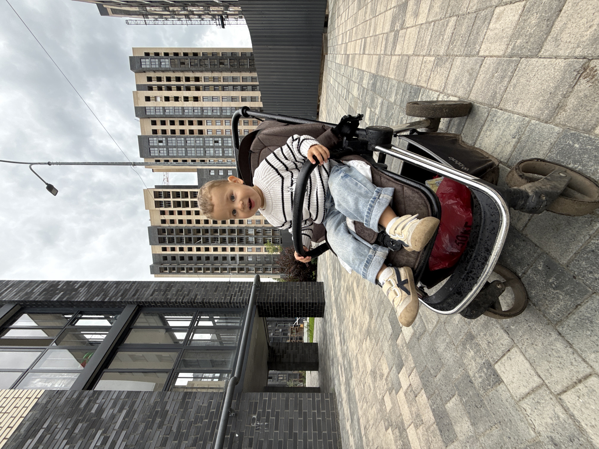 Selfies with a stroller outside Rusanovo apartment buildings