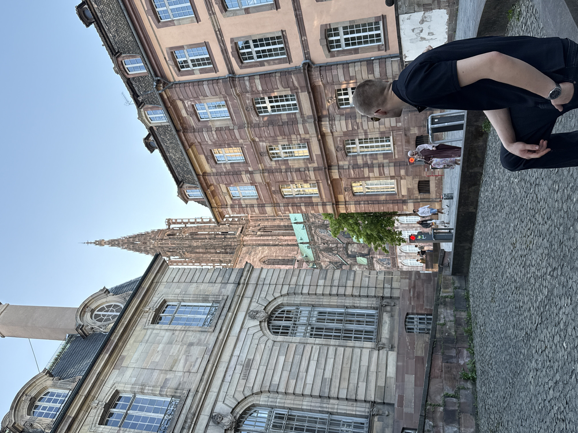 Tourist captures casual street scenes during Strasbourg walking tour