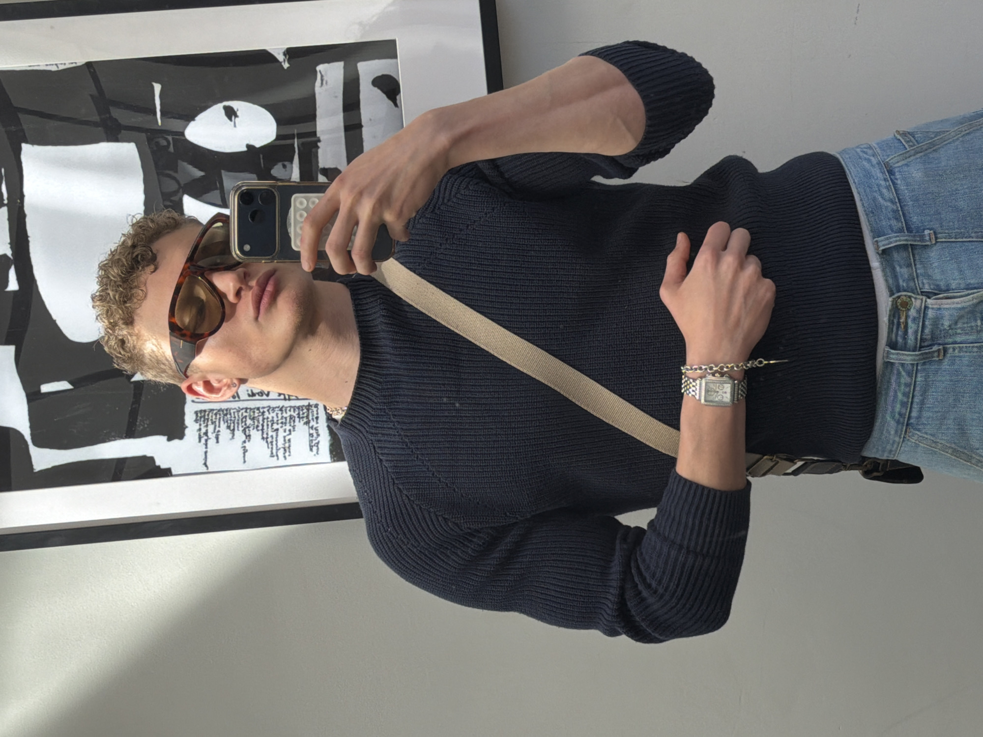 Young man takes mirror selfies in Wandsworth home