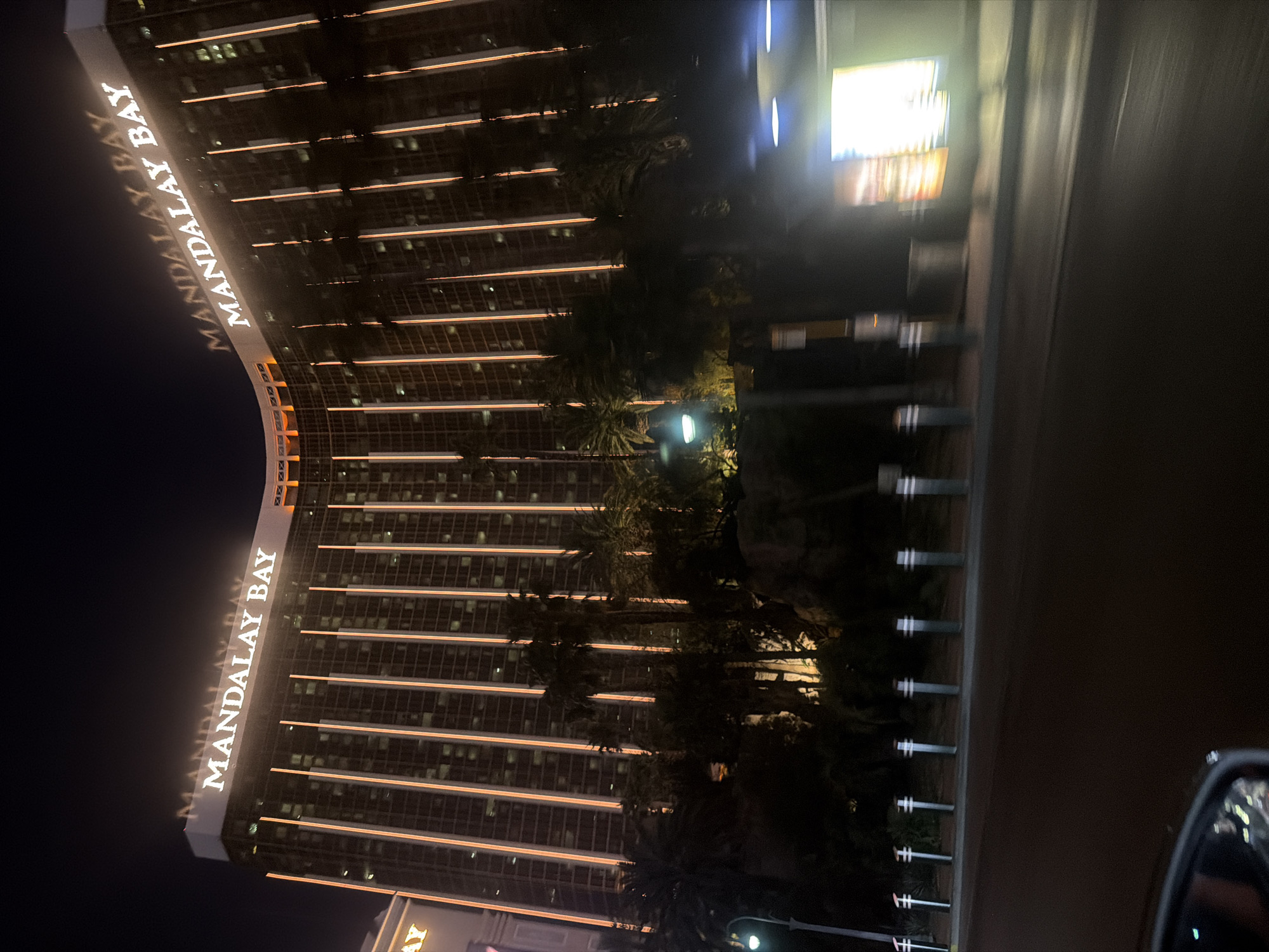 Mandalay Bay Resort illuminated during late night hours in Vegas