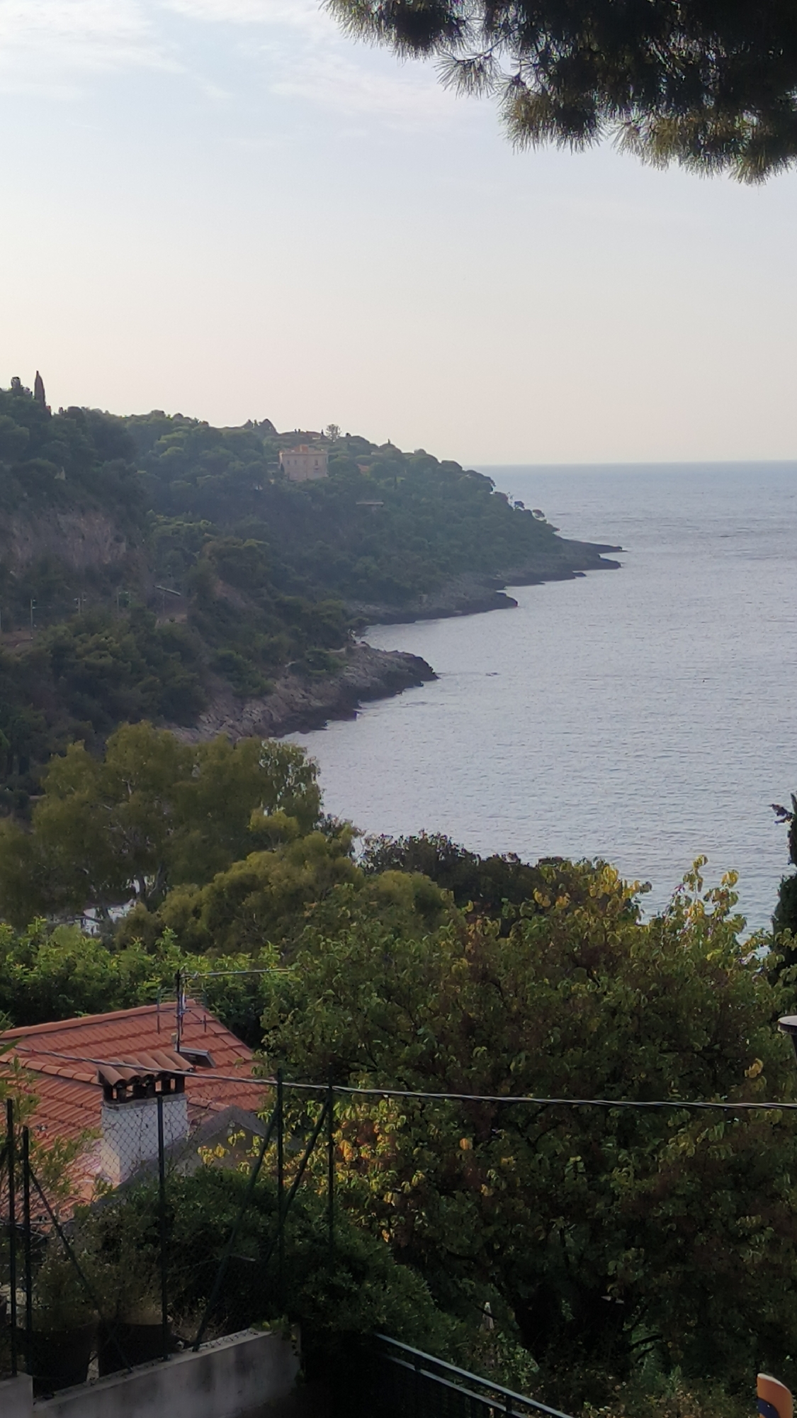 Mediterranean coastal city, rooftops to street-level details