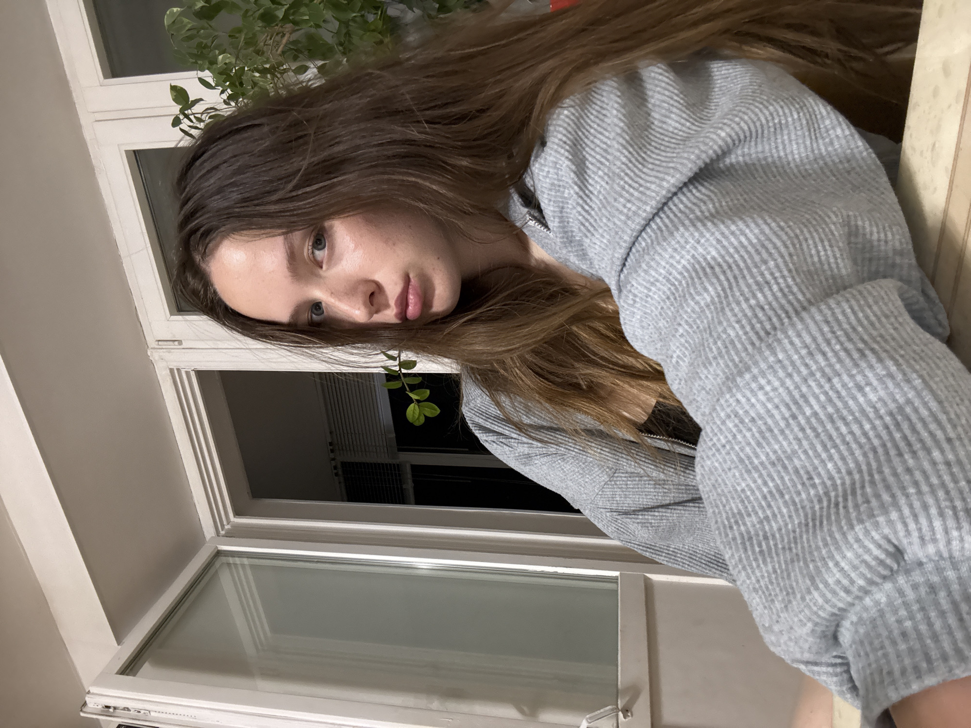 Woman photographed in multiple poses near window in Chaikovsky