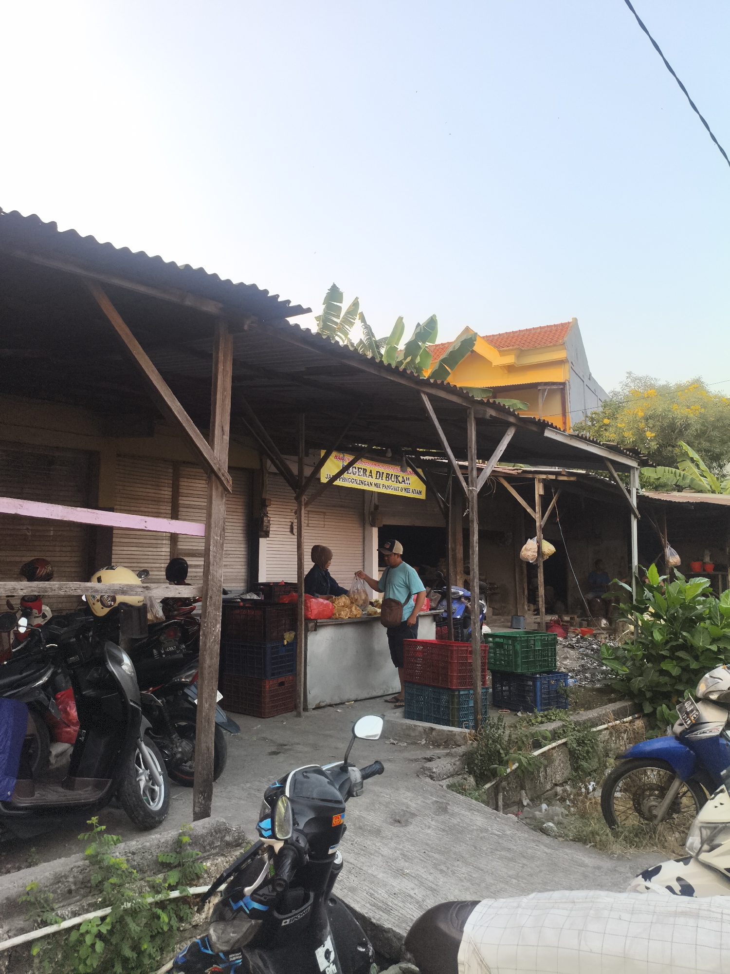 Informal street market activity in Surabaya, late evening