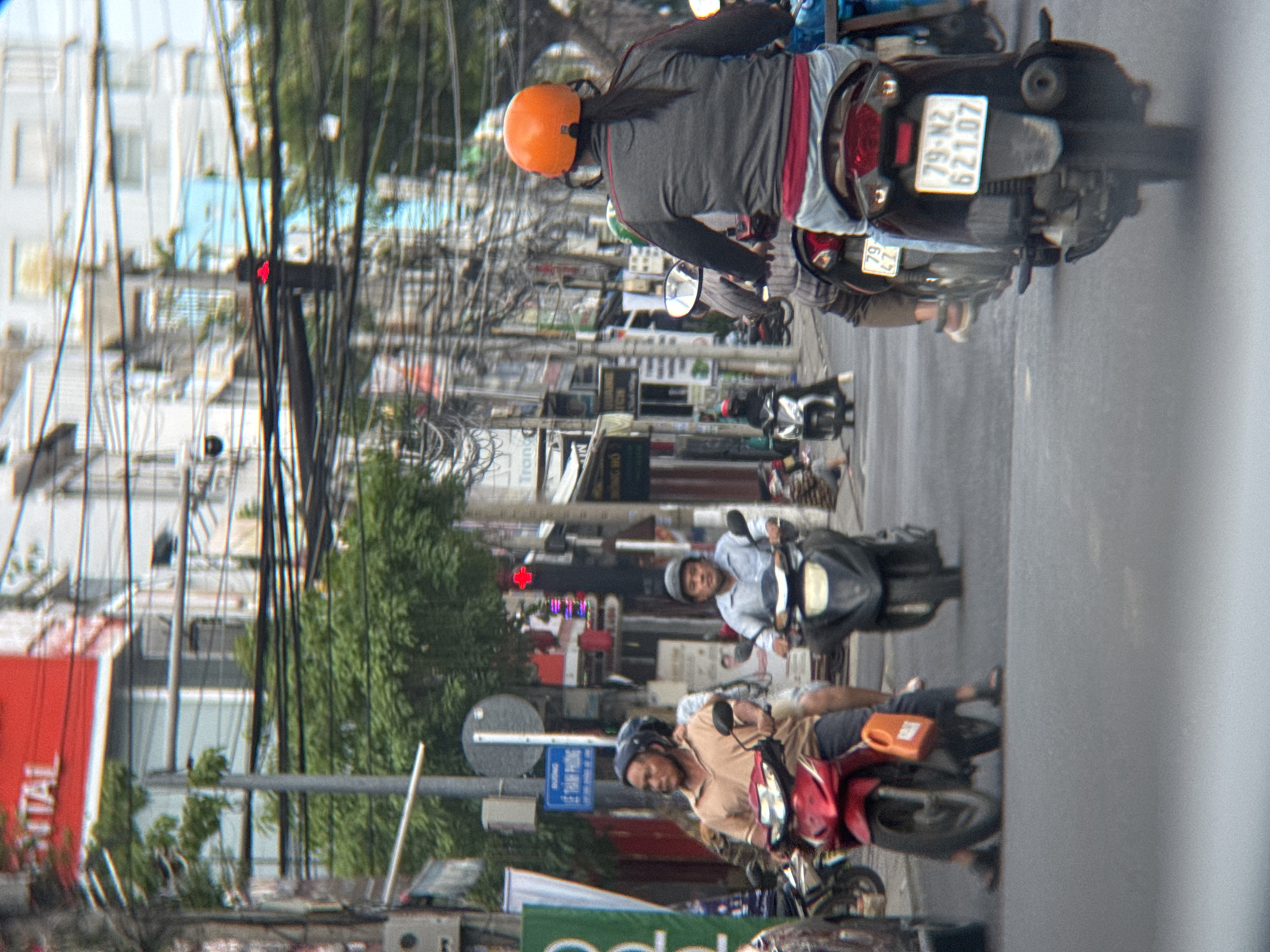 Morning motorbike traffic moves through a Nha Trang intersection