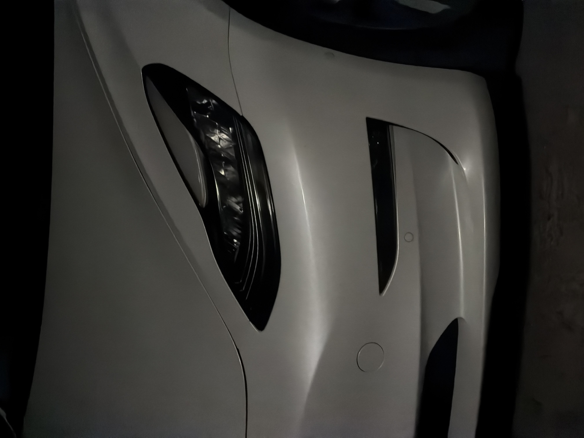 Late-night hangout at a Bila Tserkva property with a Tesla outside