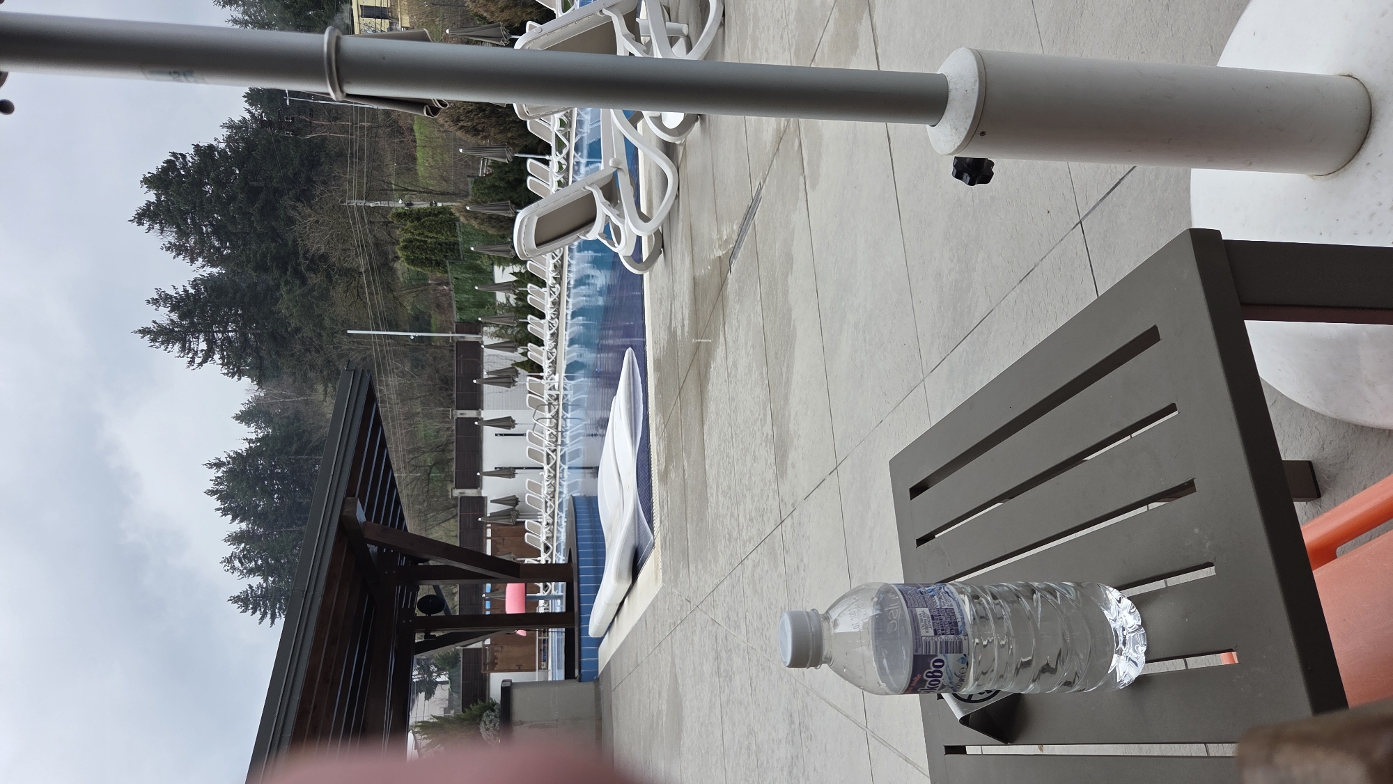 Pool area with lounge chairs observed in Bania, Bulgaria