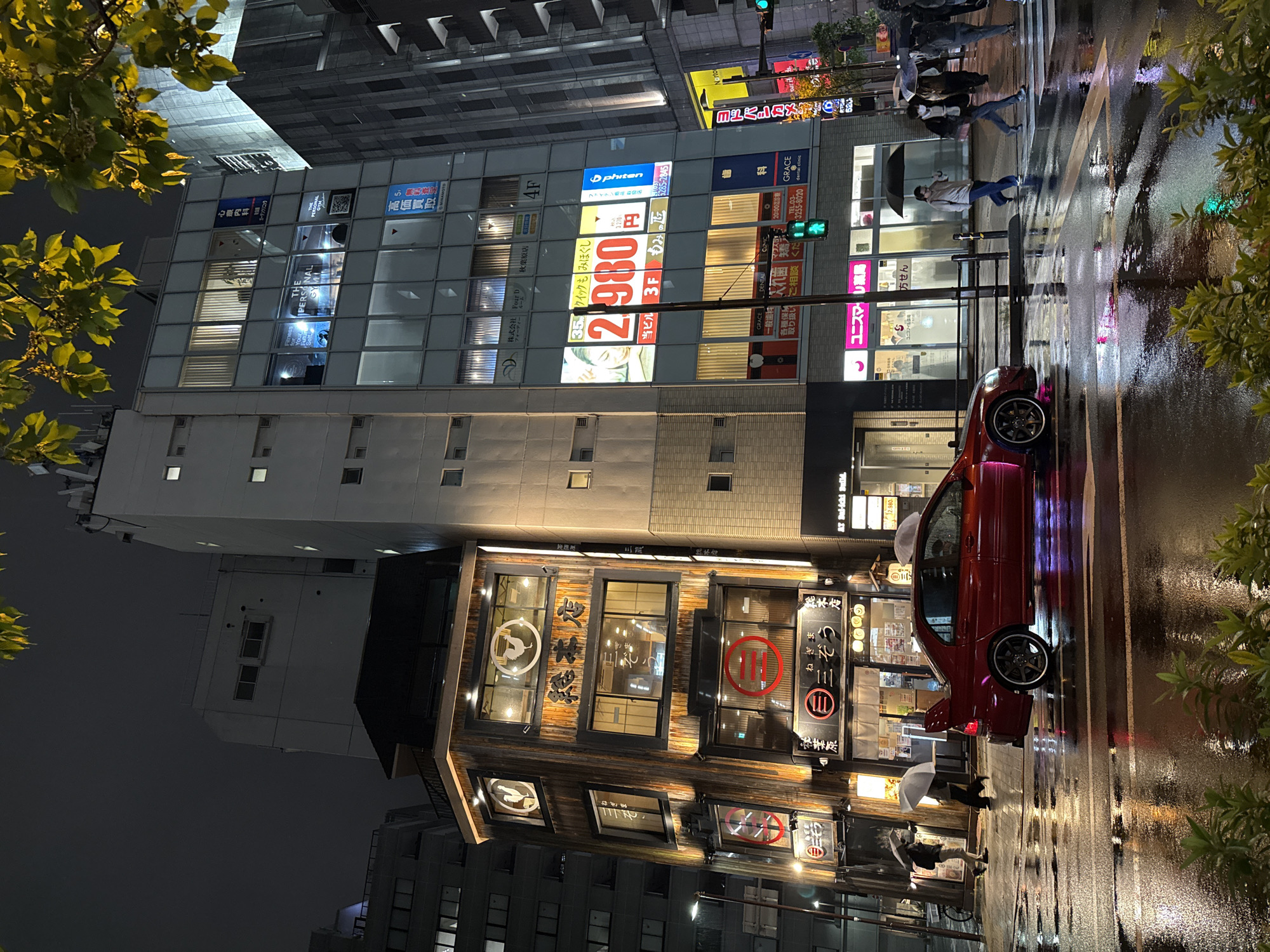 Wet street scene captured in Chiyoda following rainfall