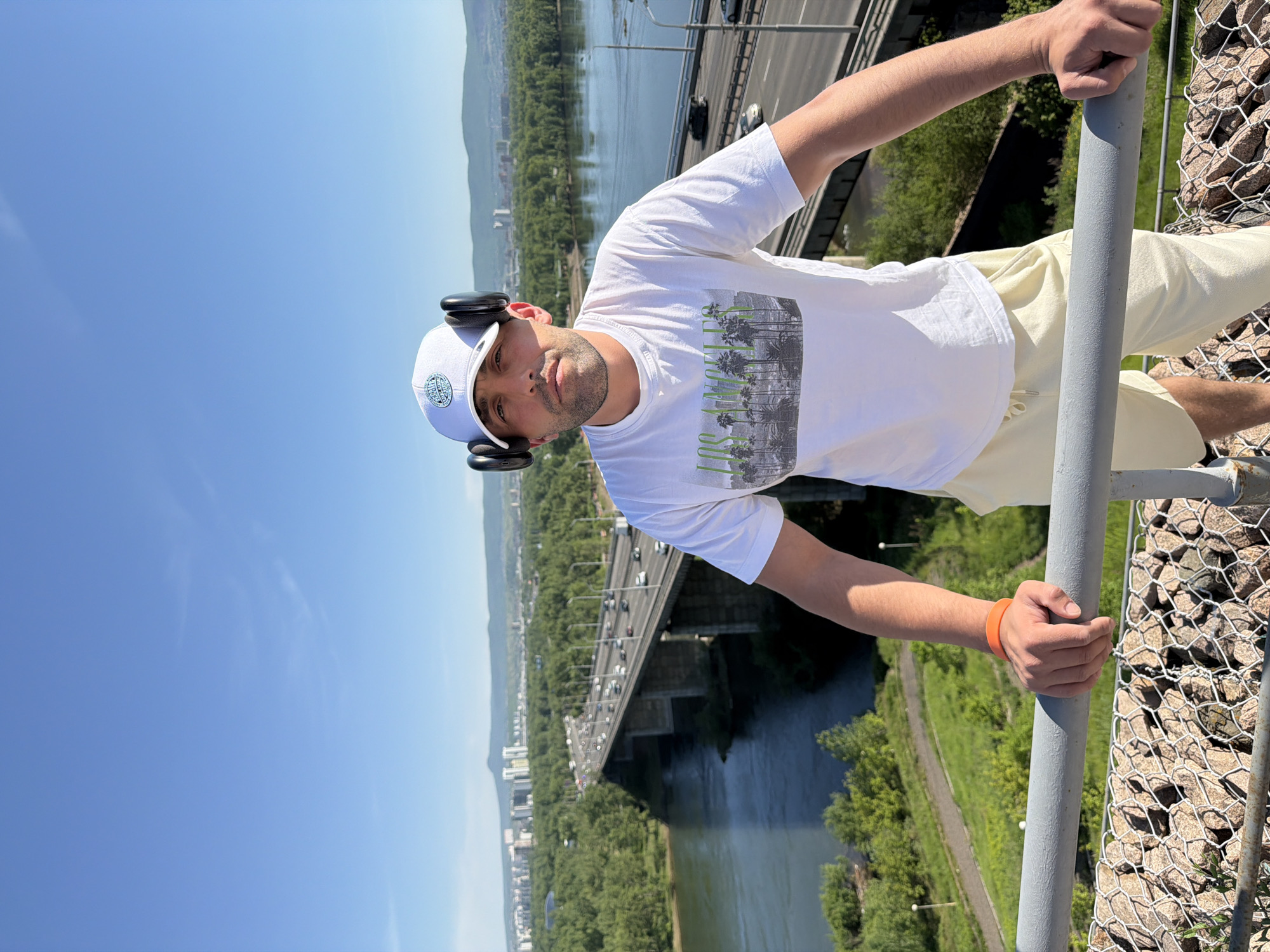 Tourist photographed at Krasnoyarsk river overlook wearing LA shirt