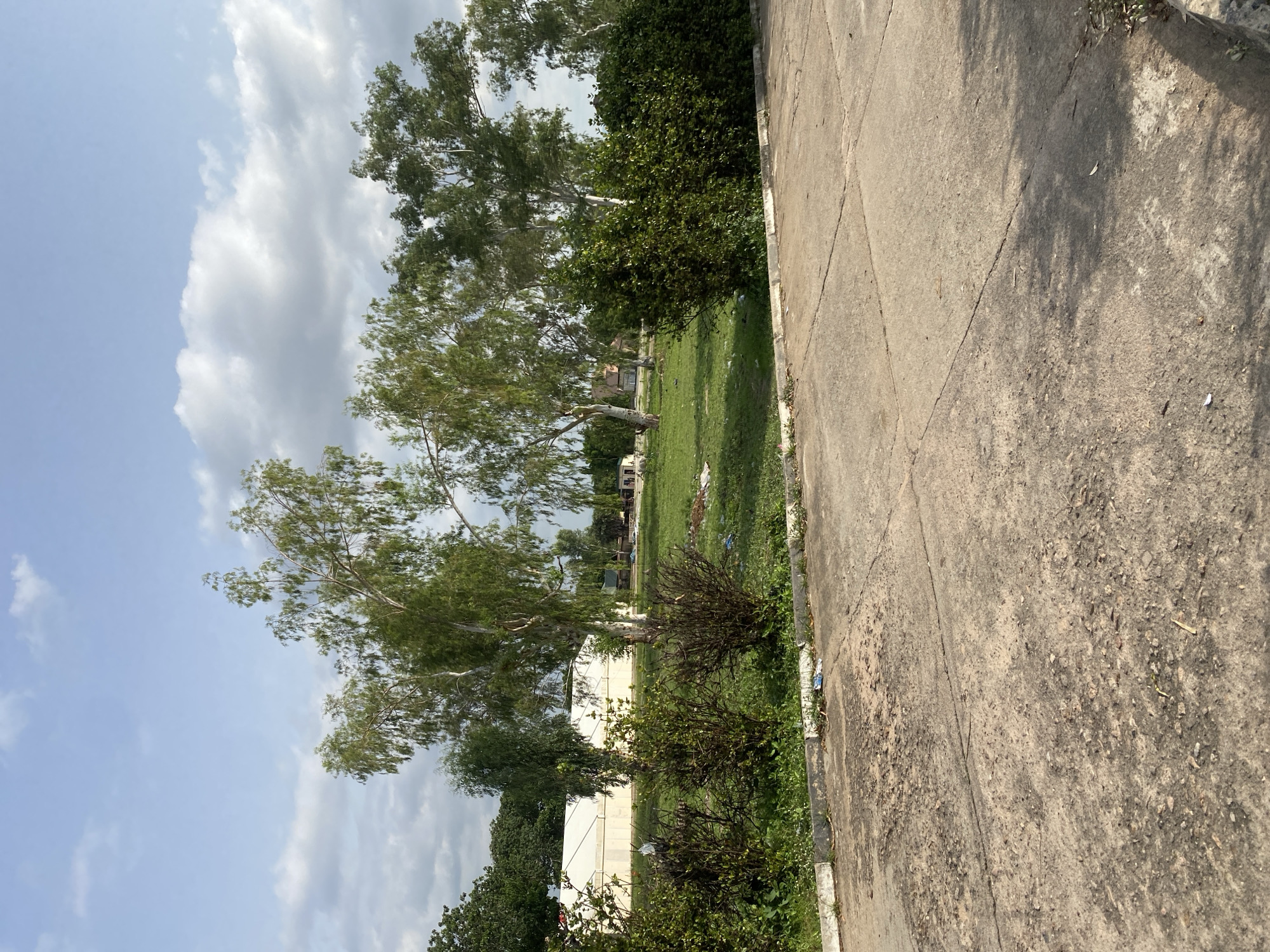Weathered basketball court in Jalingo, Nigeria, on a clear afternoon