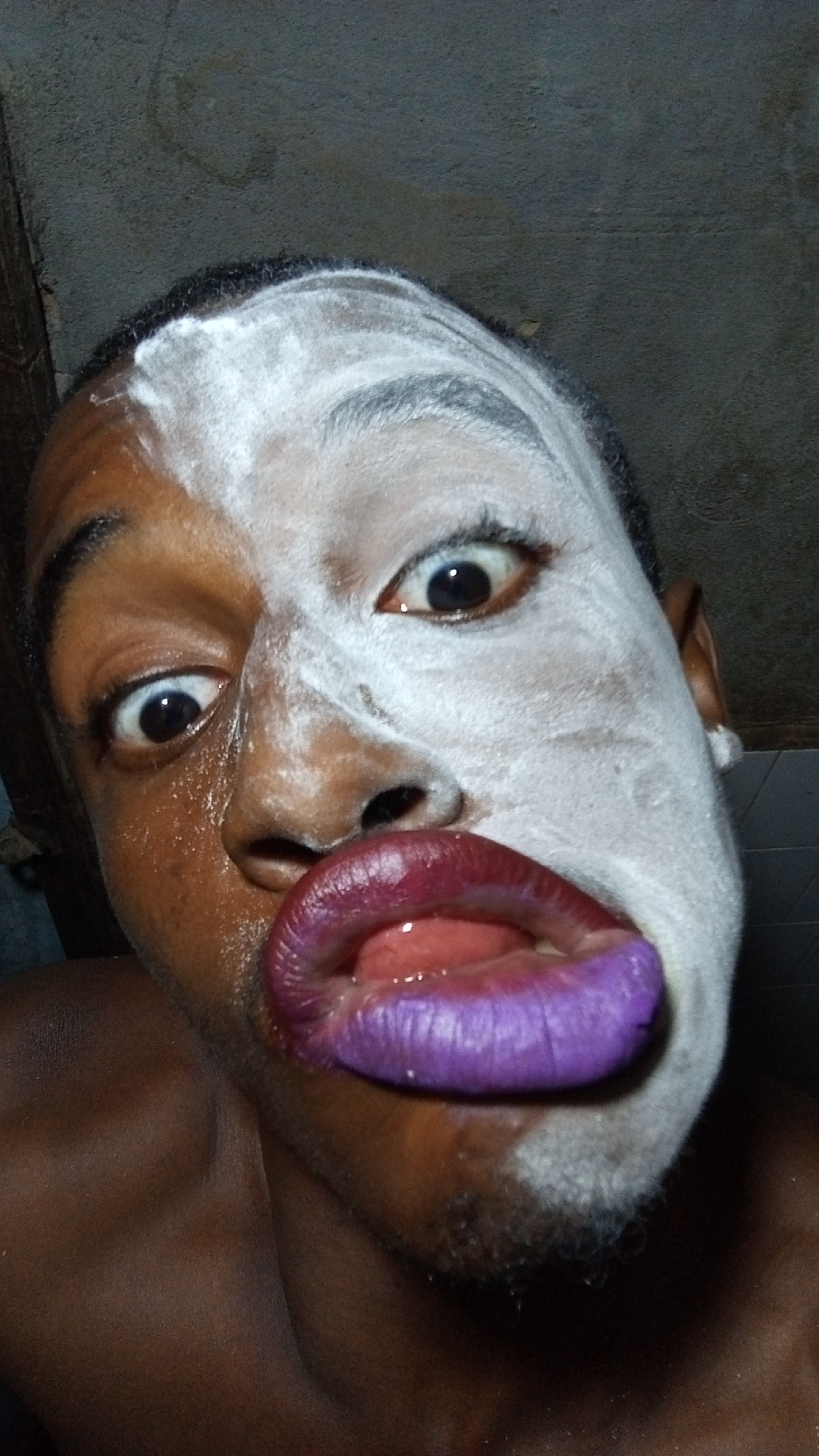 Person spotted with half-face white paint at unknown location