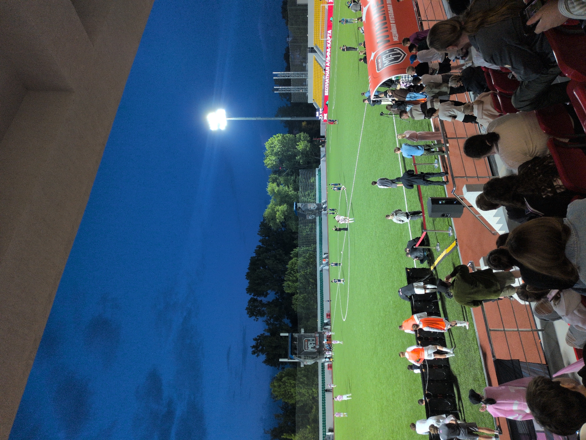 Evening football match under floodlights in Vnukovo, Russia