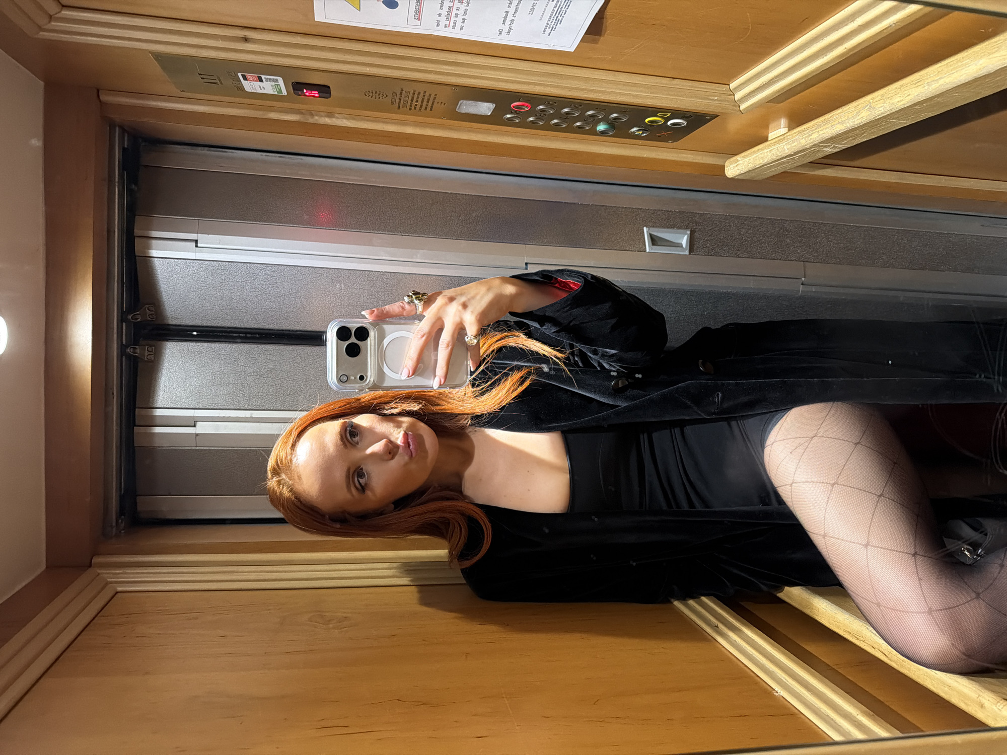 Woman Takes Late-Night Elevator Selfie in Paris