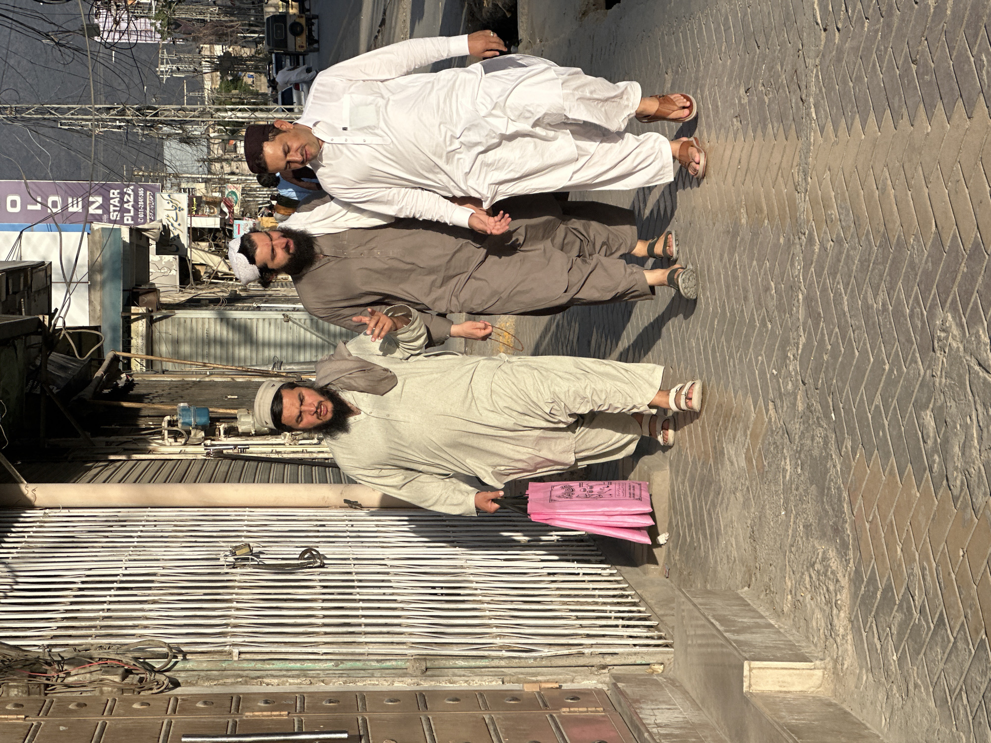 Street scene with multiple men documented in Quetta