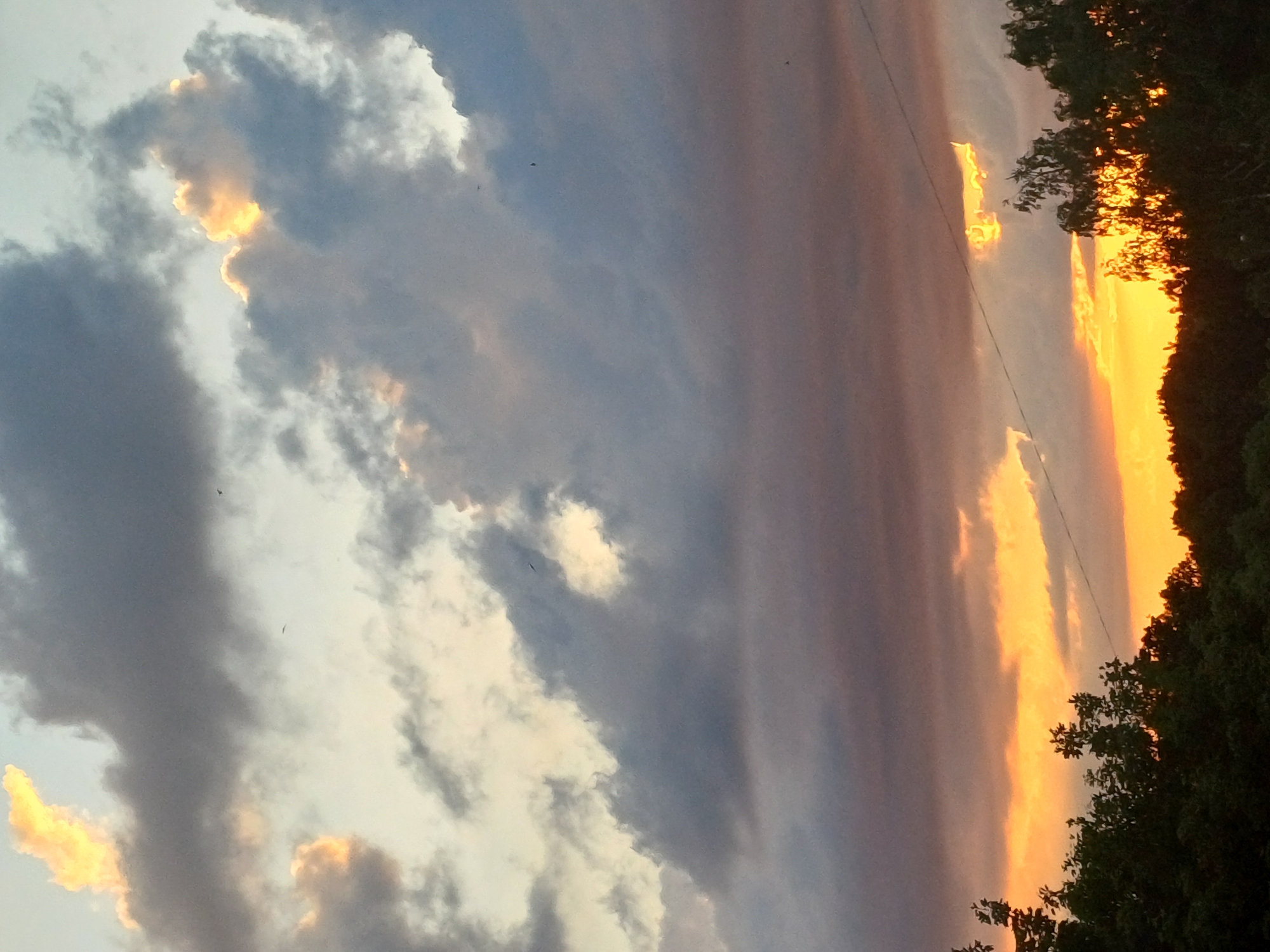 Riga's midsummer sunset, caught from multiple angles