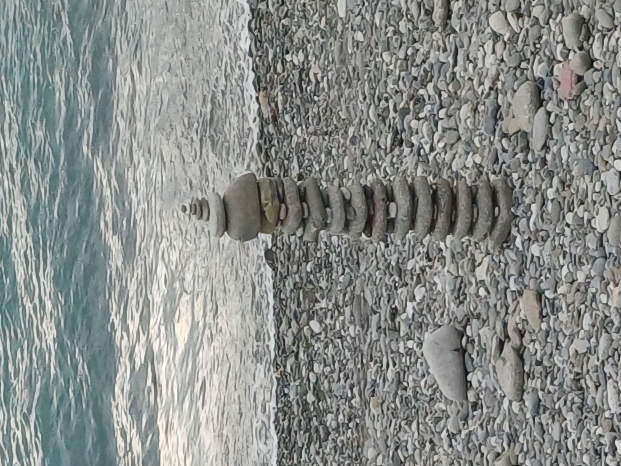 Cloudy summer day on Sochi's Black Sea pebble beach