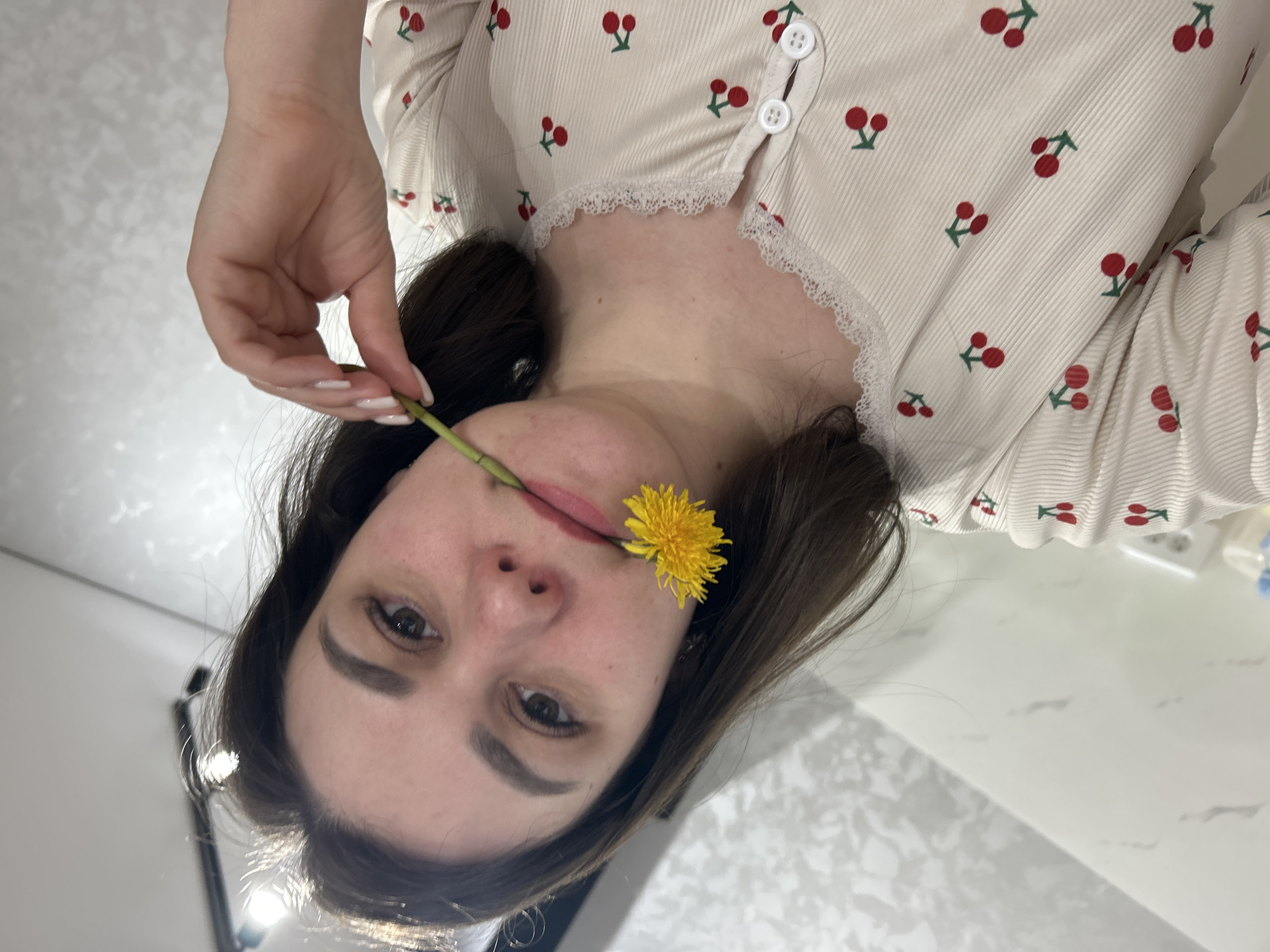 Woman poses with dandelions in springtime photo session