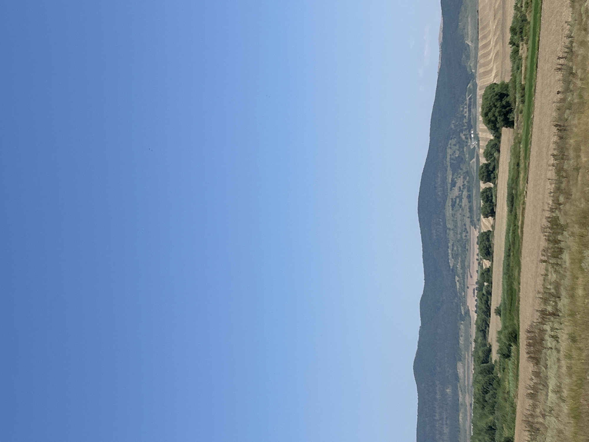 Hay baling underway in the fields outside Poroy, Bulgaria
