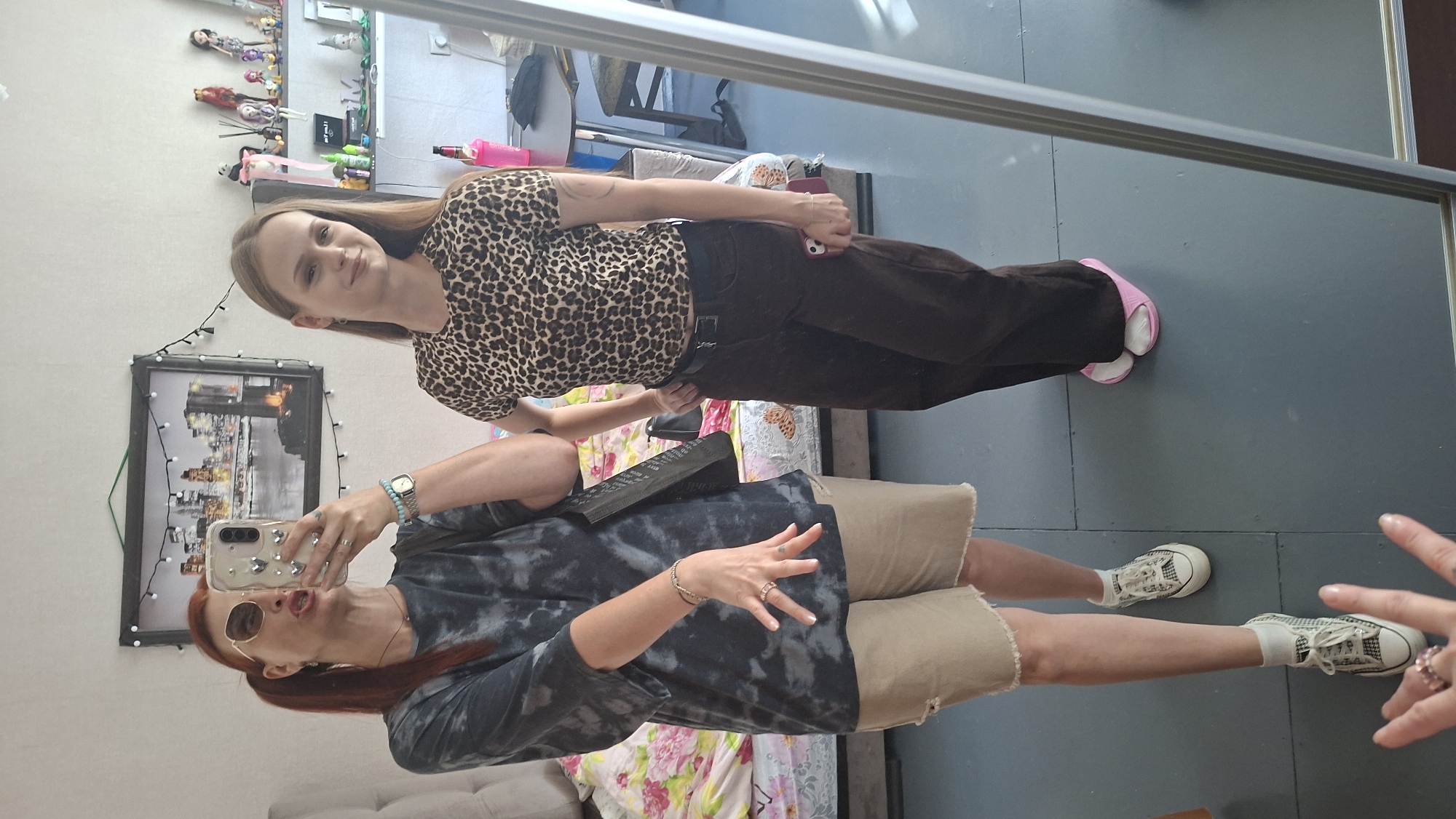 Mirror selfies and a dressed-up Sphynx cat, indoors in Belarus