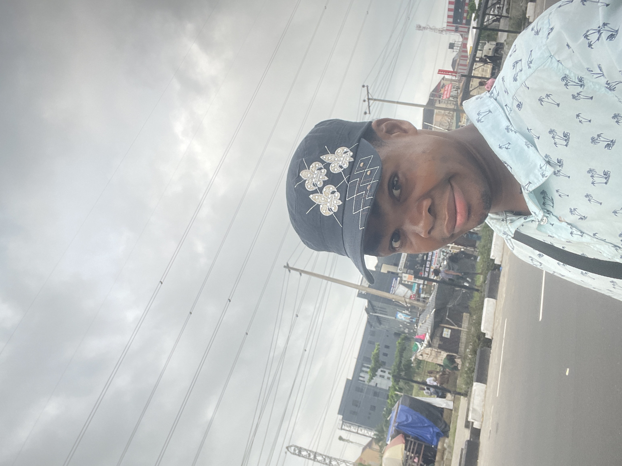 Selfie moment on a Lagos street, cloudy morning