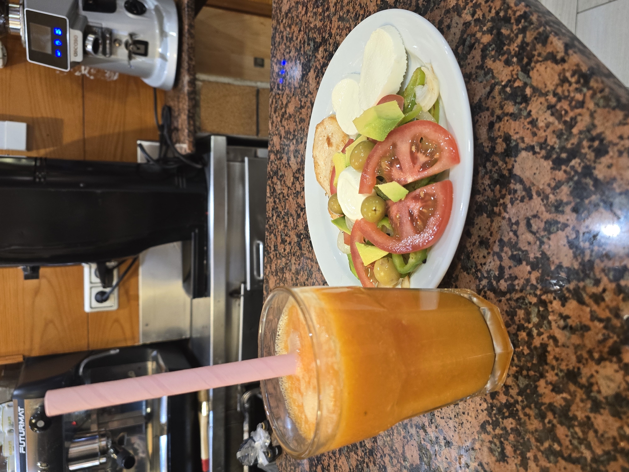 Lunch with orange juice and salad in Barcelona
